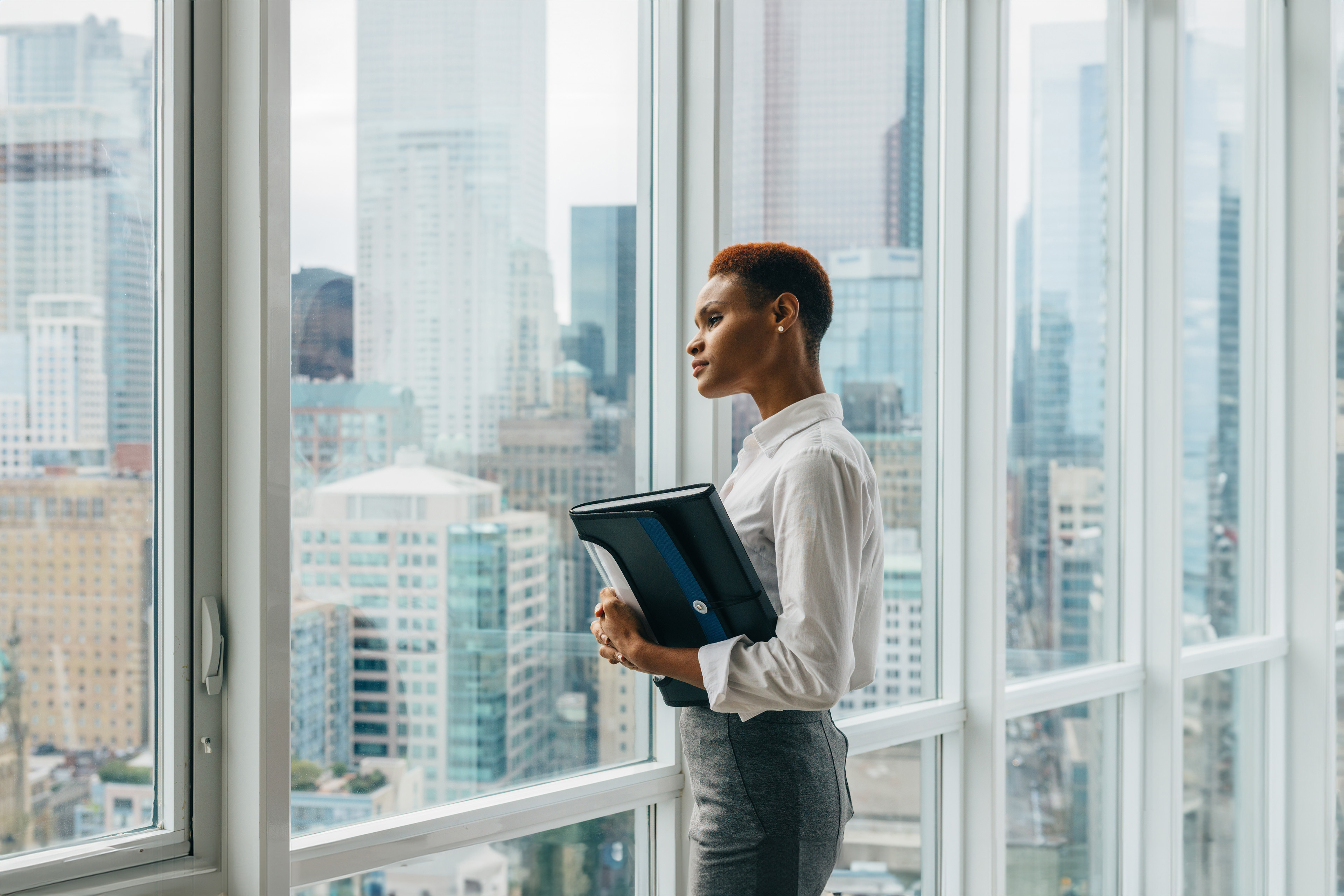 Businesswoman looking out a window