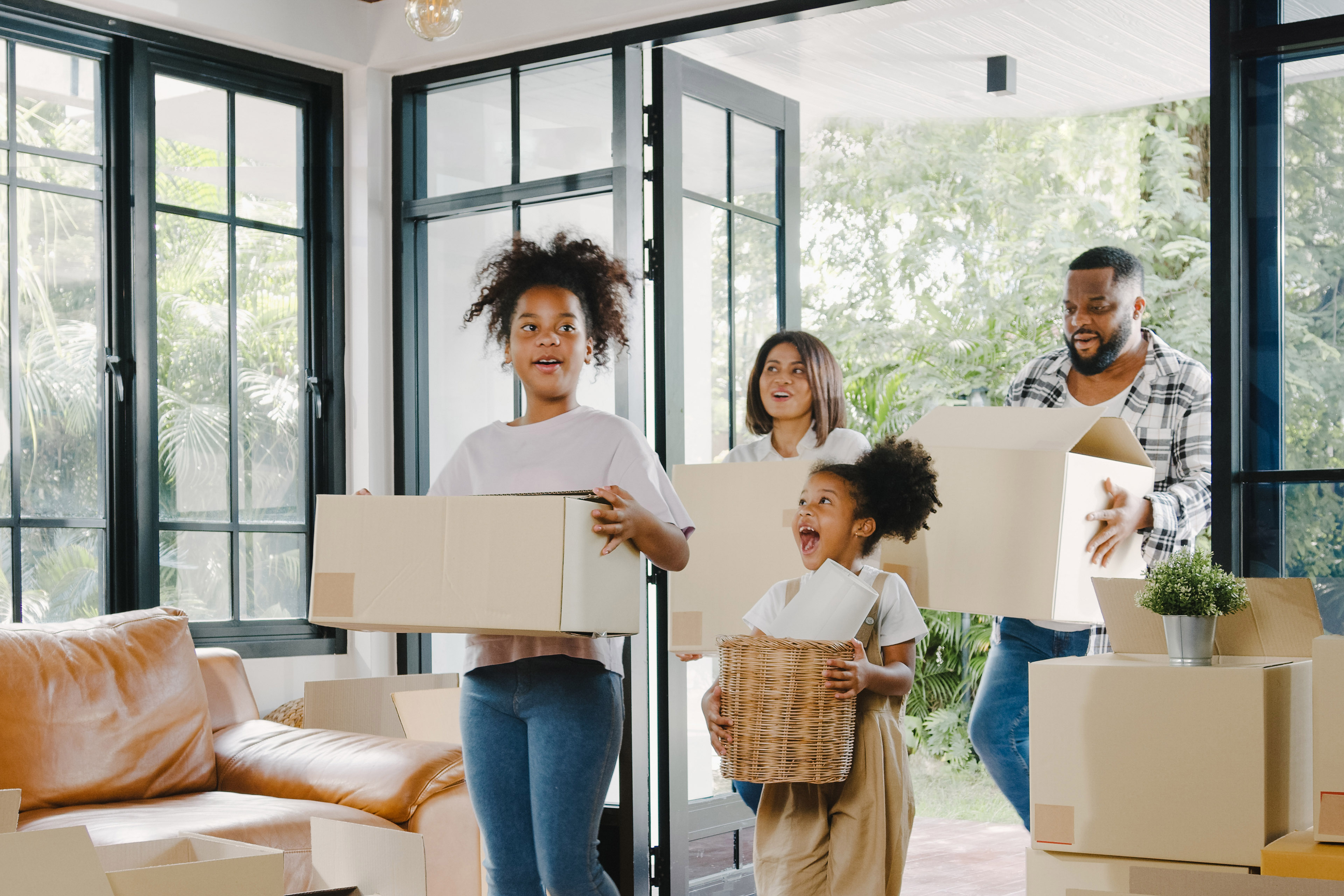 Happy african american young family bought new house