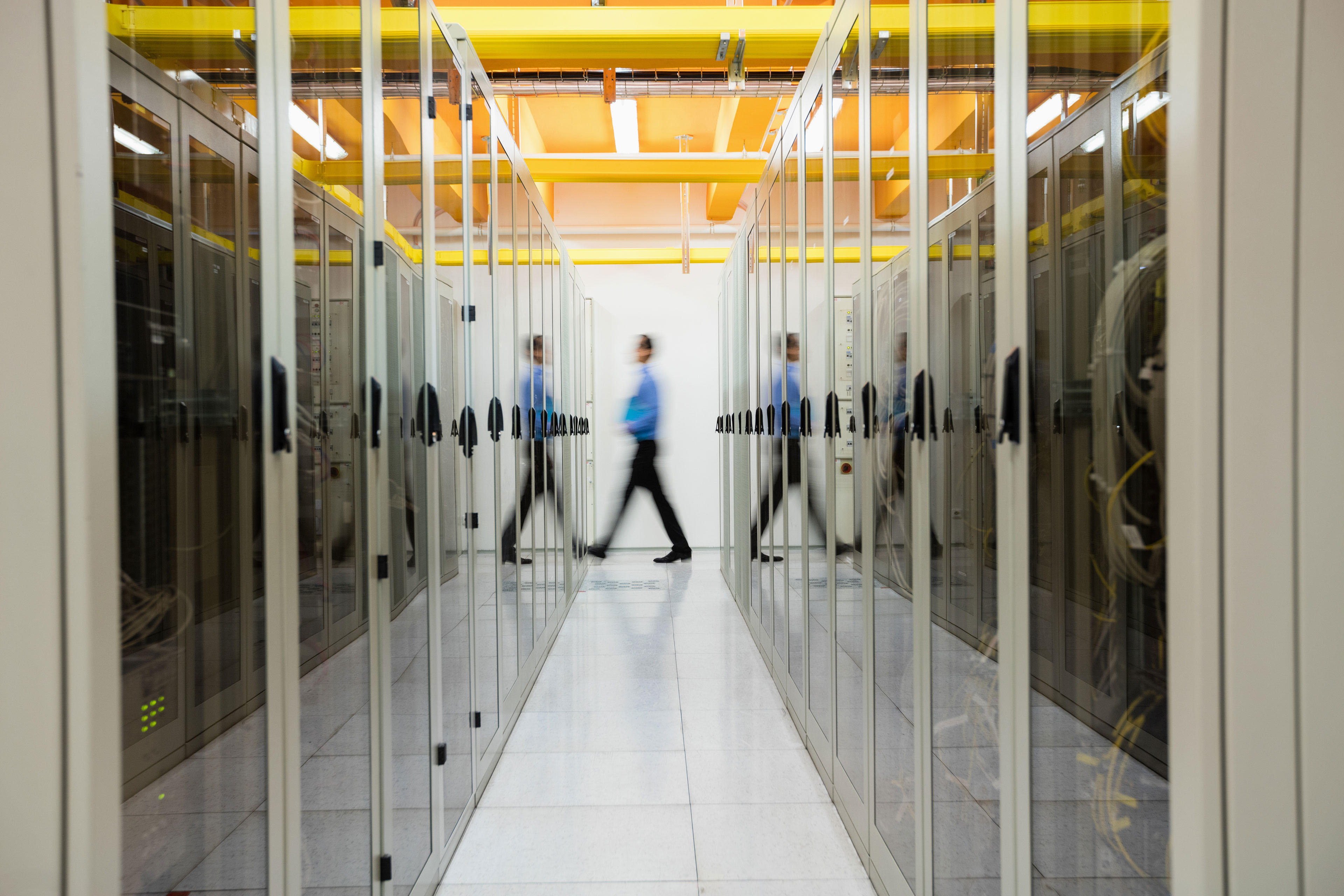 Technician walking in server room