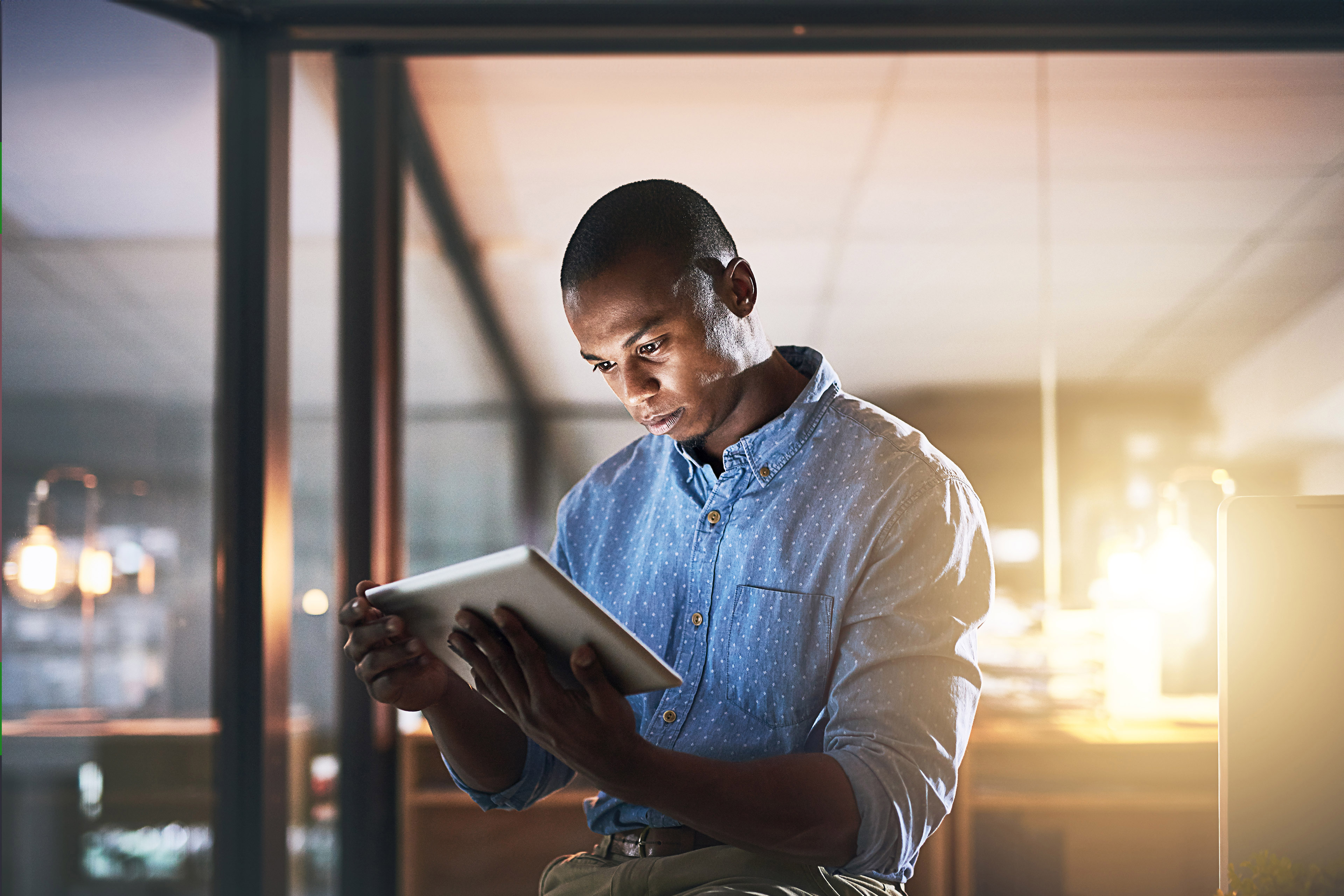 Young businessman using a digital tablet in office