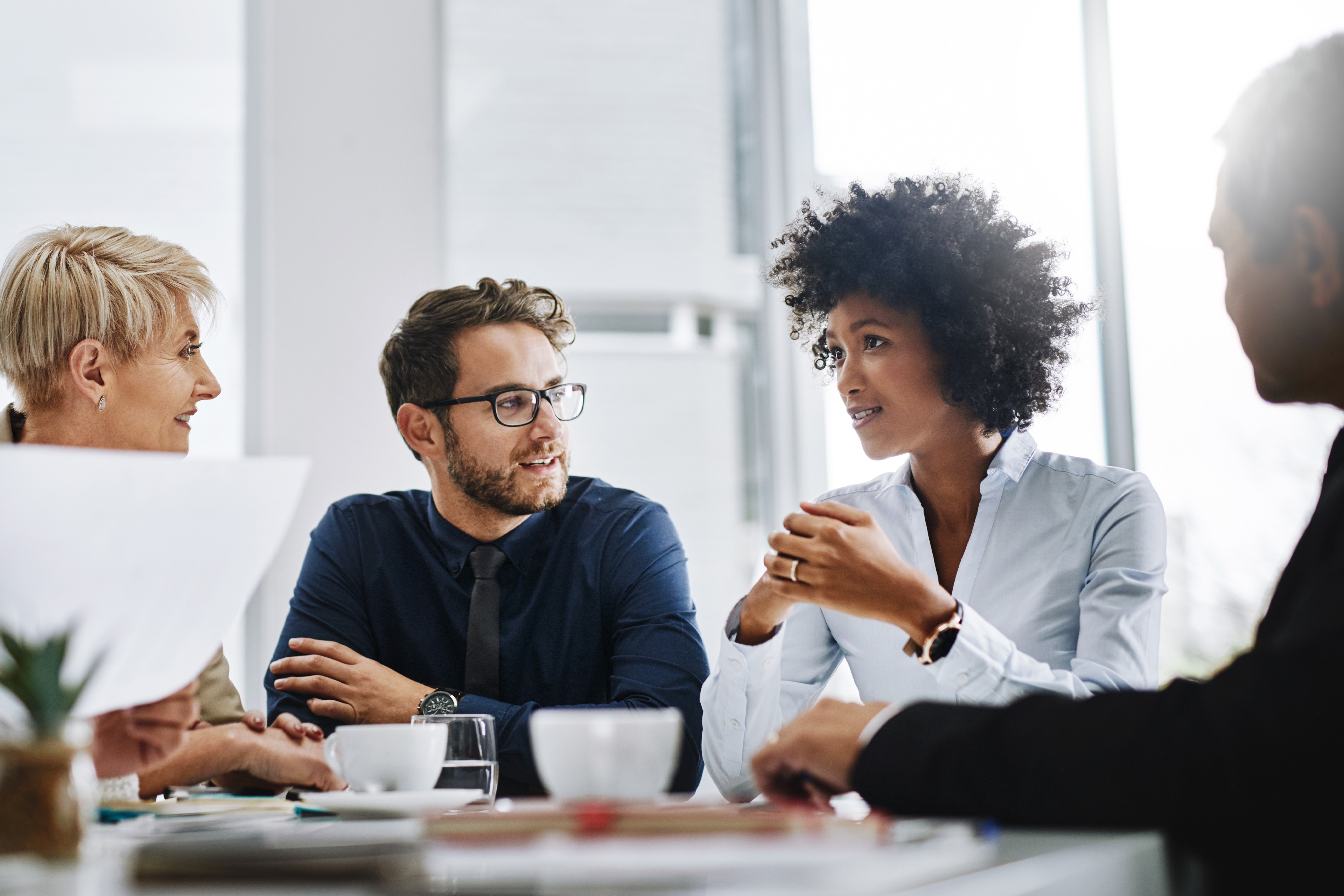 A group of businesspeople sitting together in a meeting