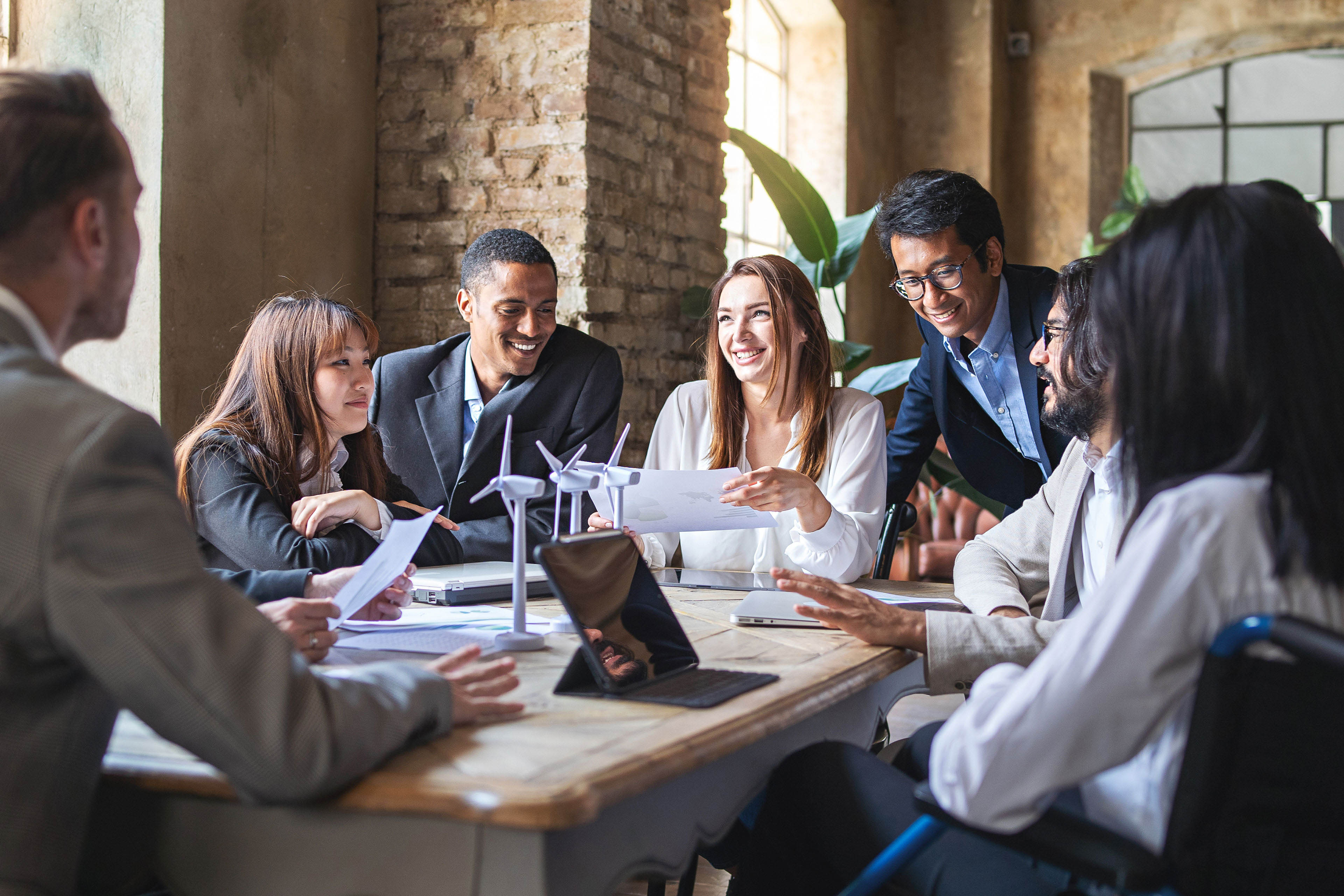 Group of people discussing renewable power