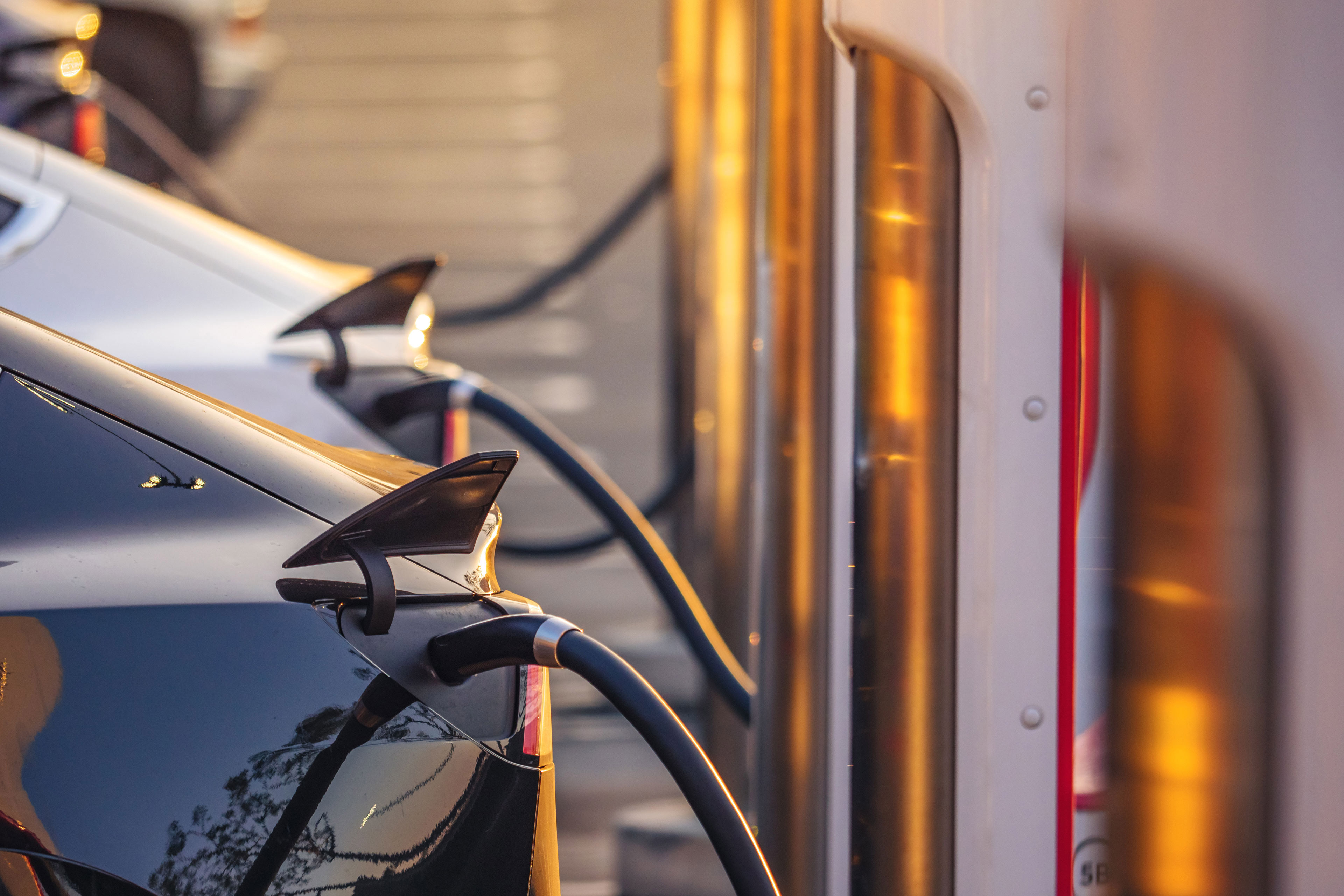 Electric cars charging at charging station