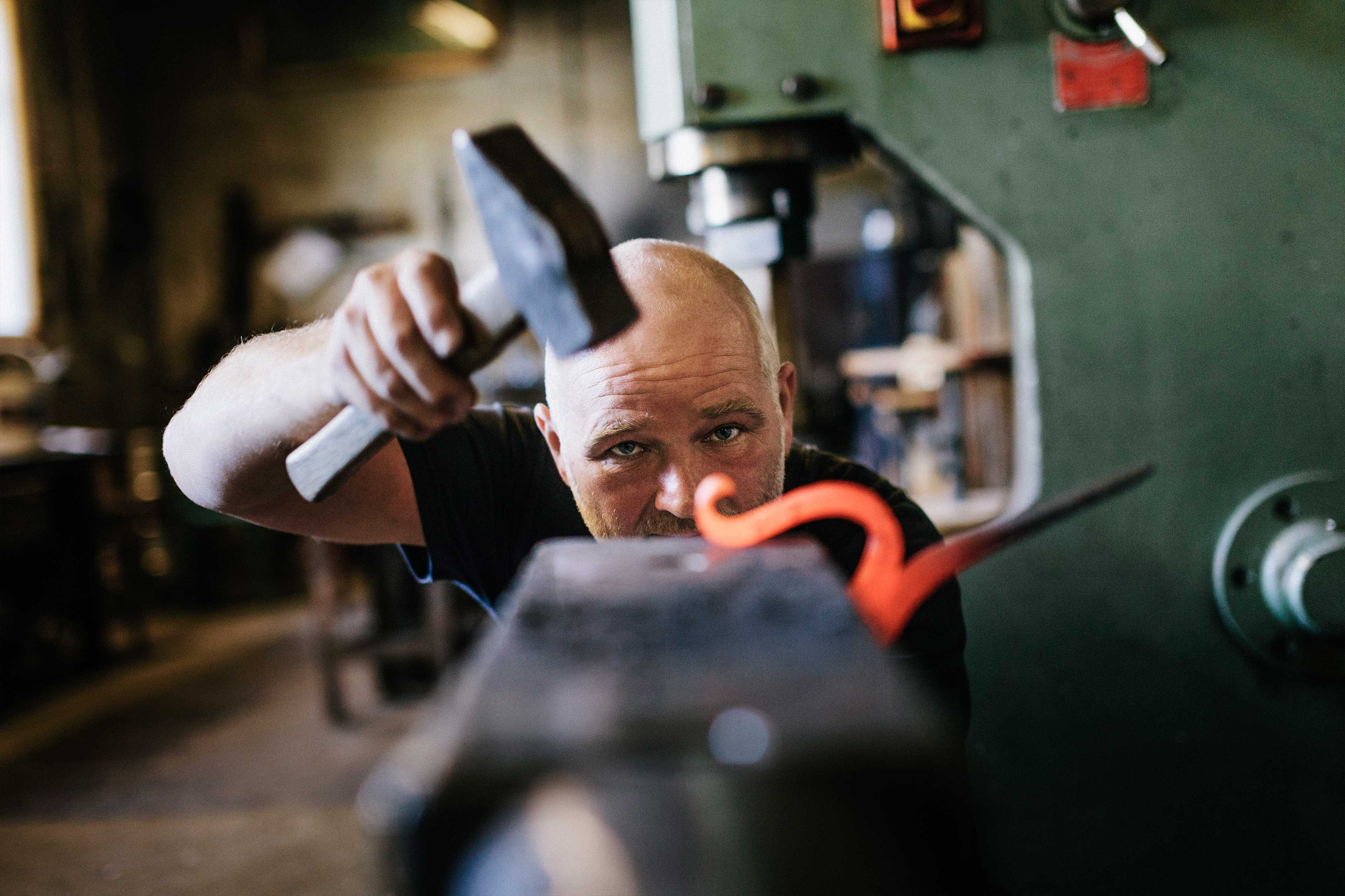 Blacksmith shaping iron