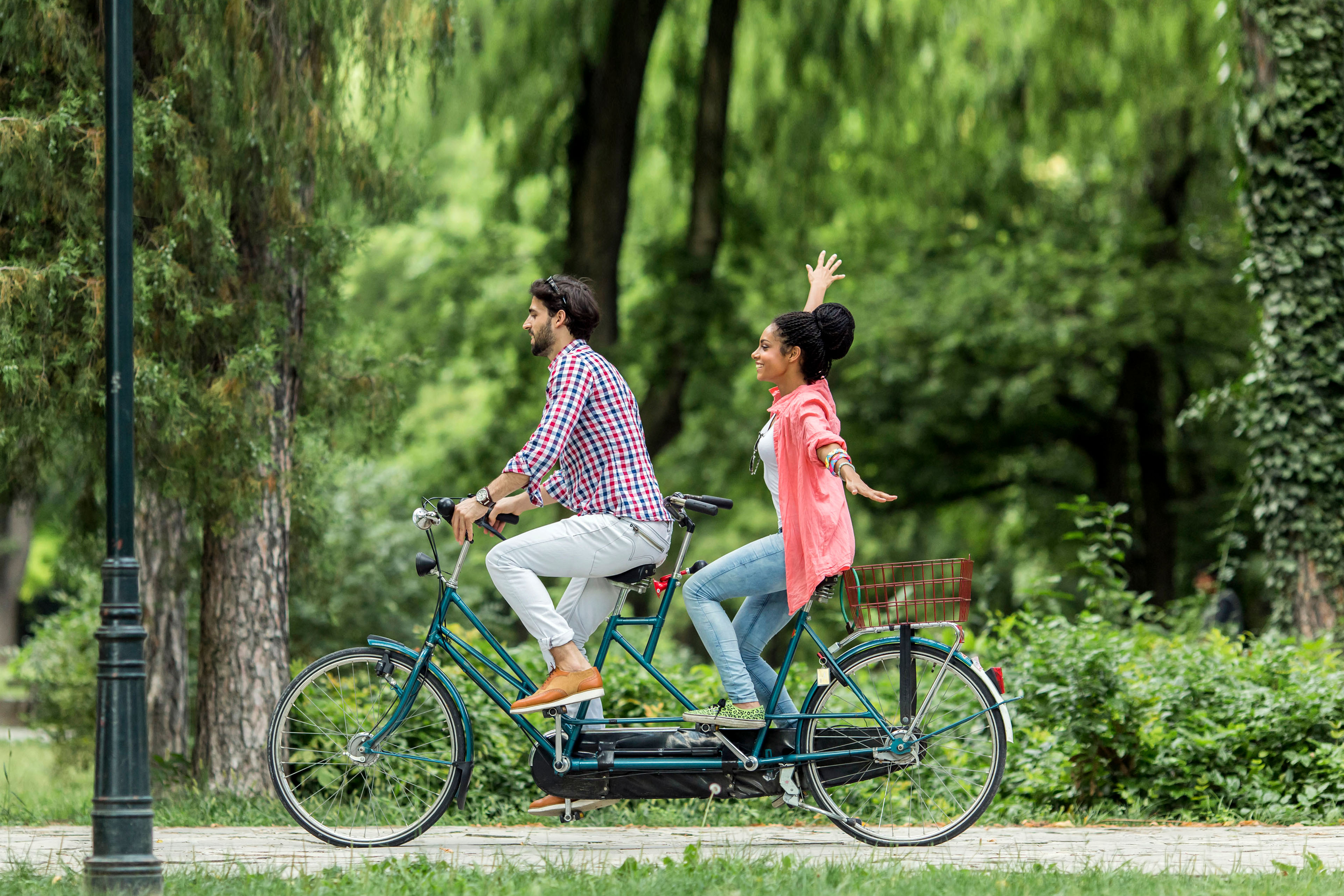 Young couple riding on the bicycle