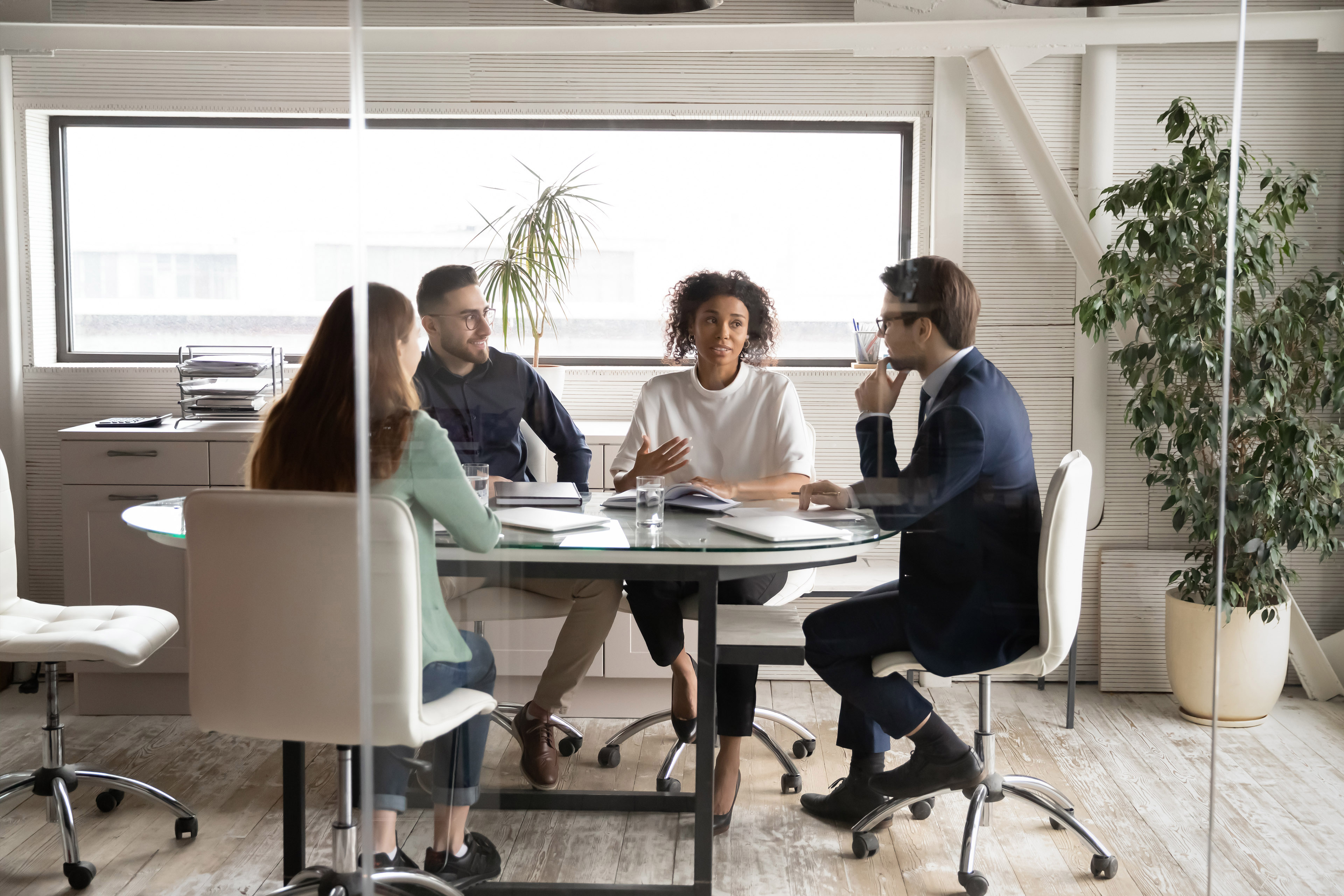 Business people brainstorming in modern board room