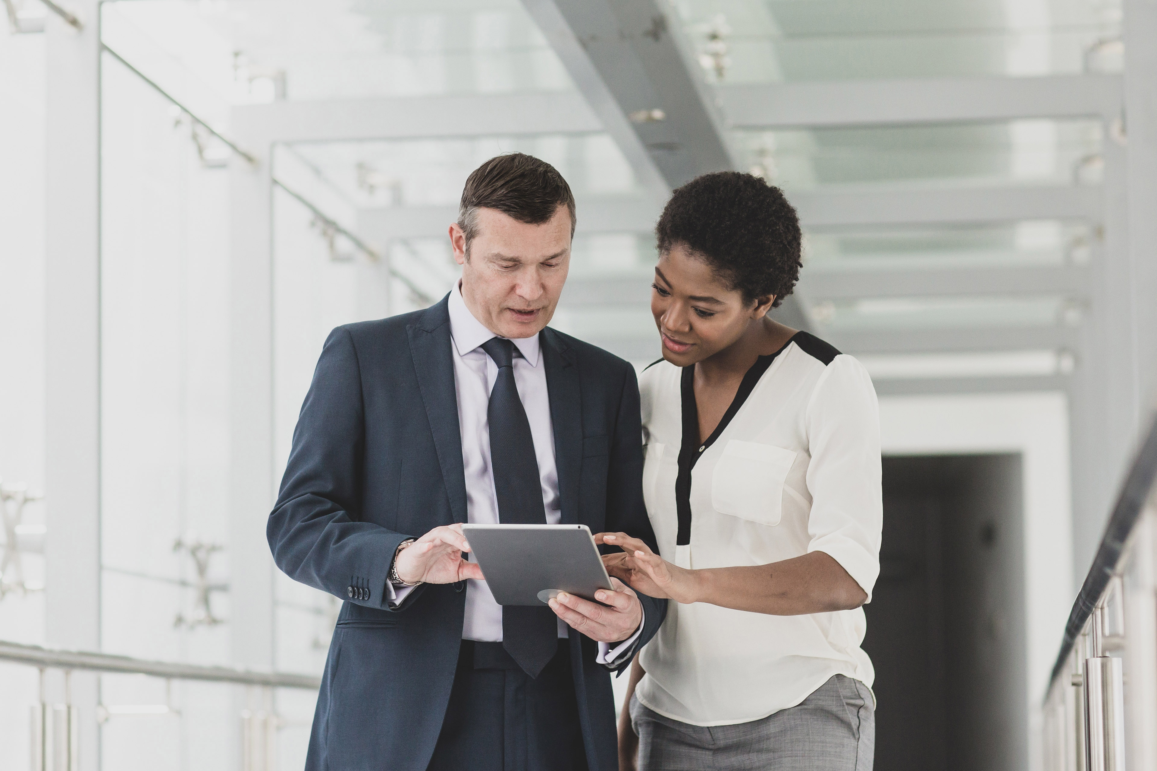 ey business people having meeting using tablet