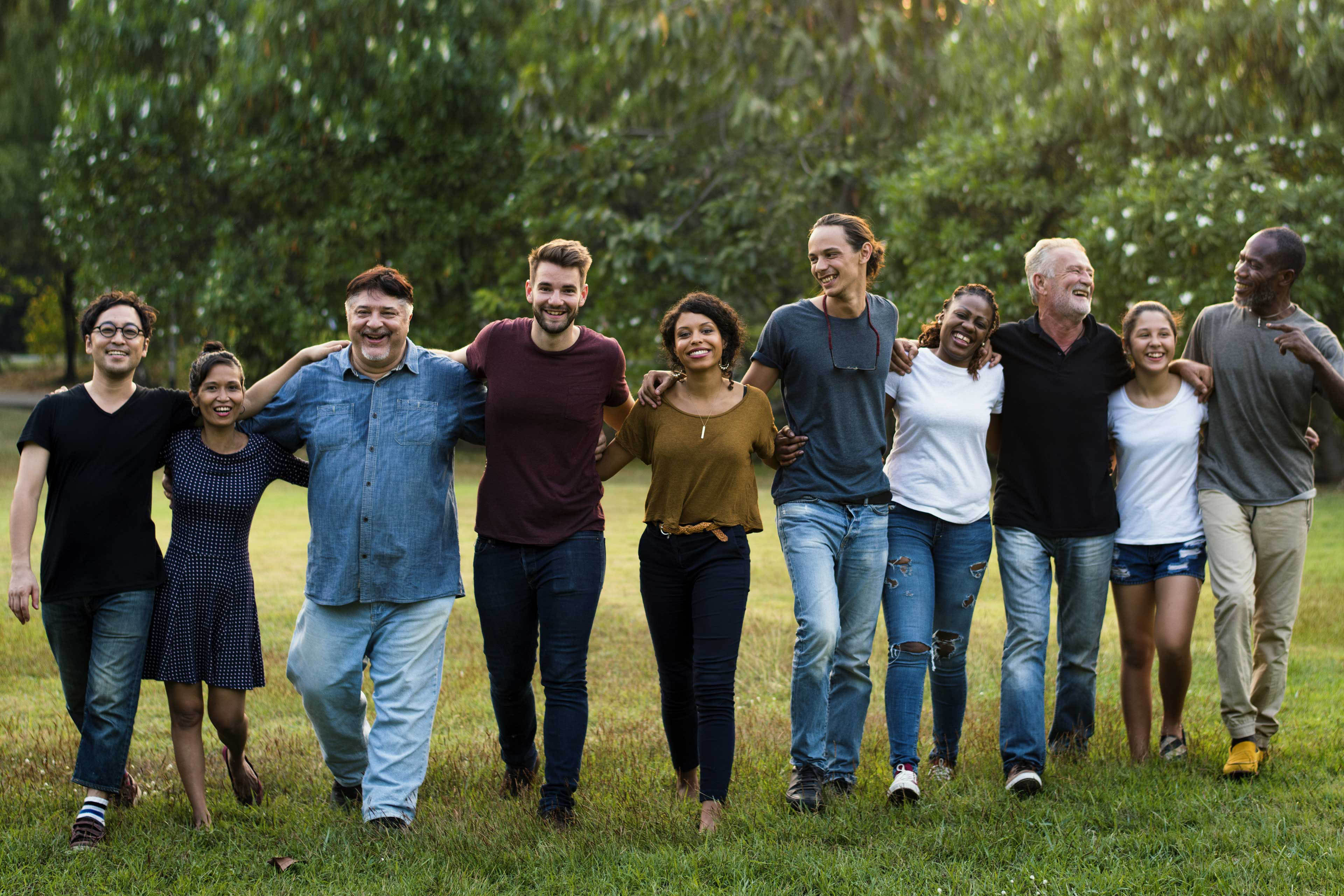 Group of people smiling huddled together