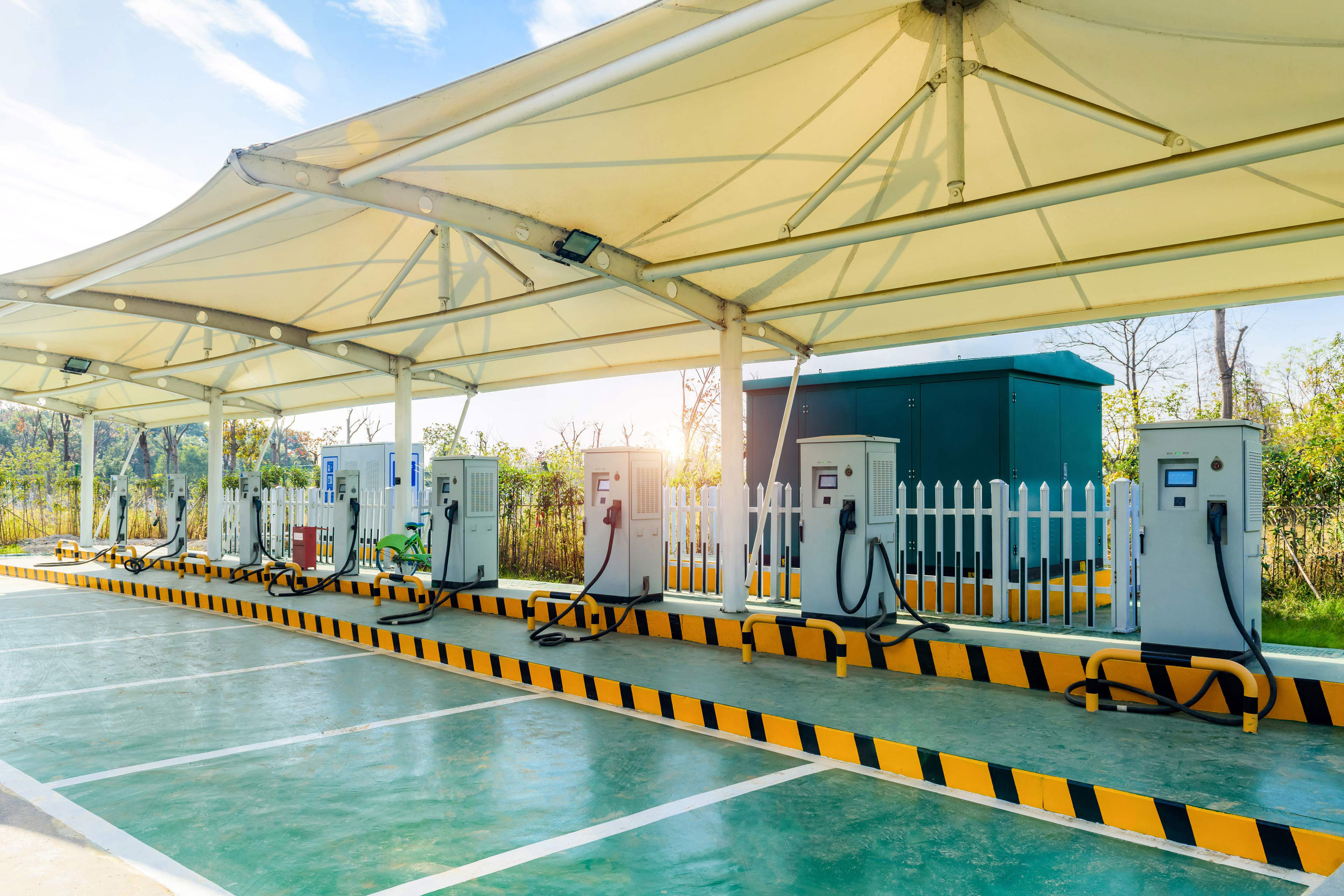 Solar powered electric car charging station in a public parking area