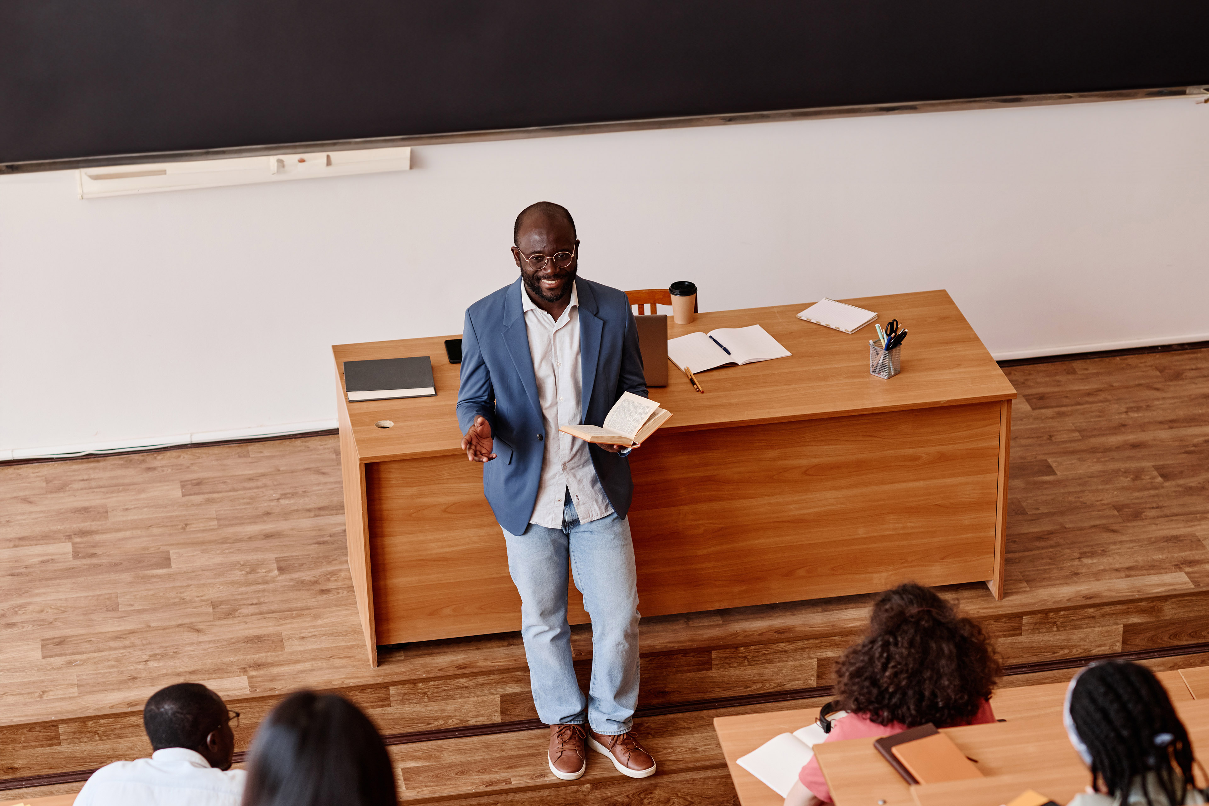 Teacher telling lecture to students at university