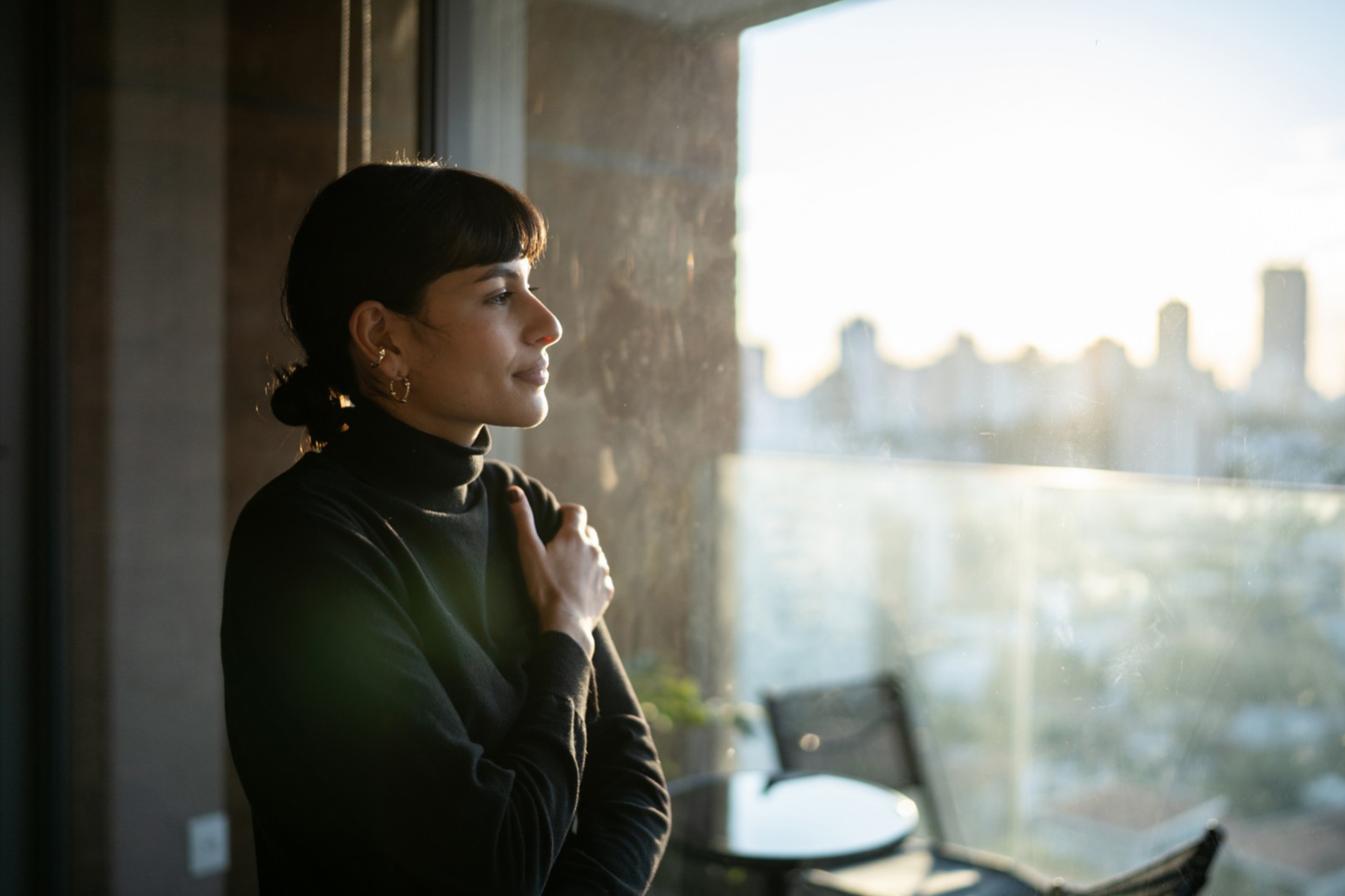 Young woman contemplating at home