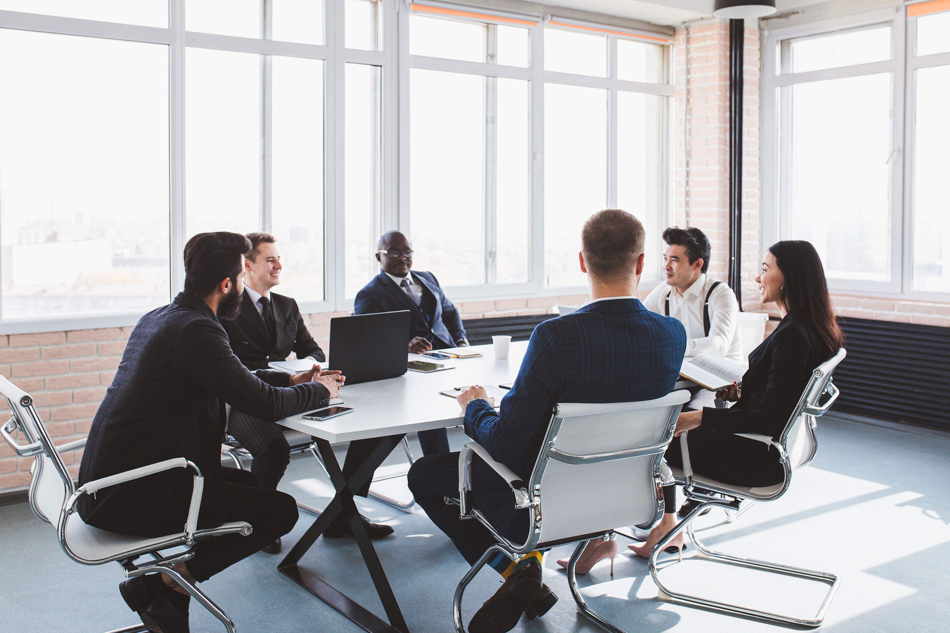 EY - Group-of-business-people-having-a-business-meeting