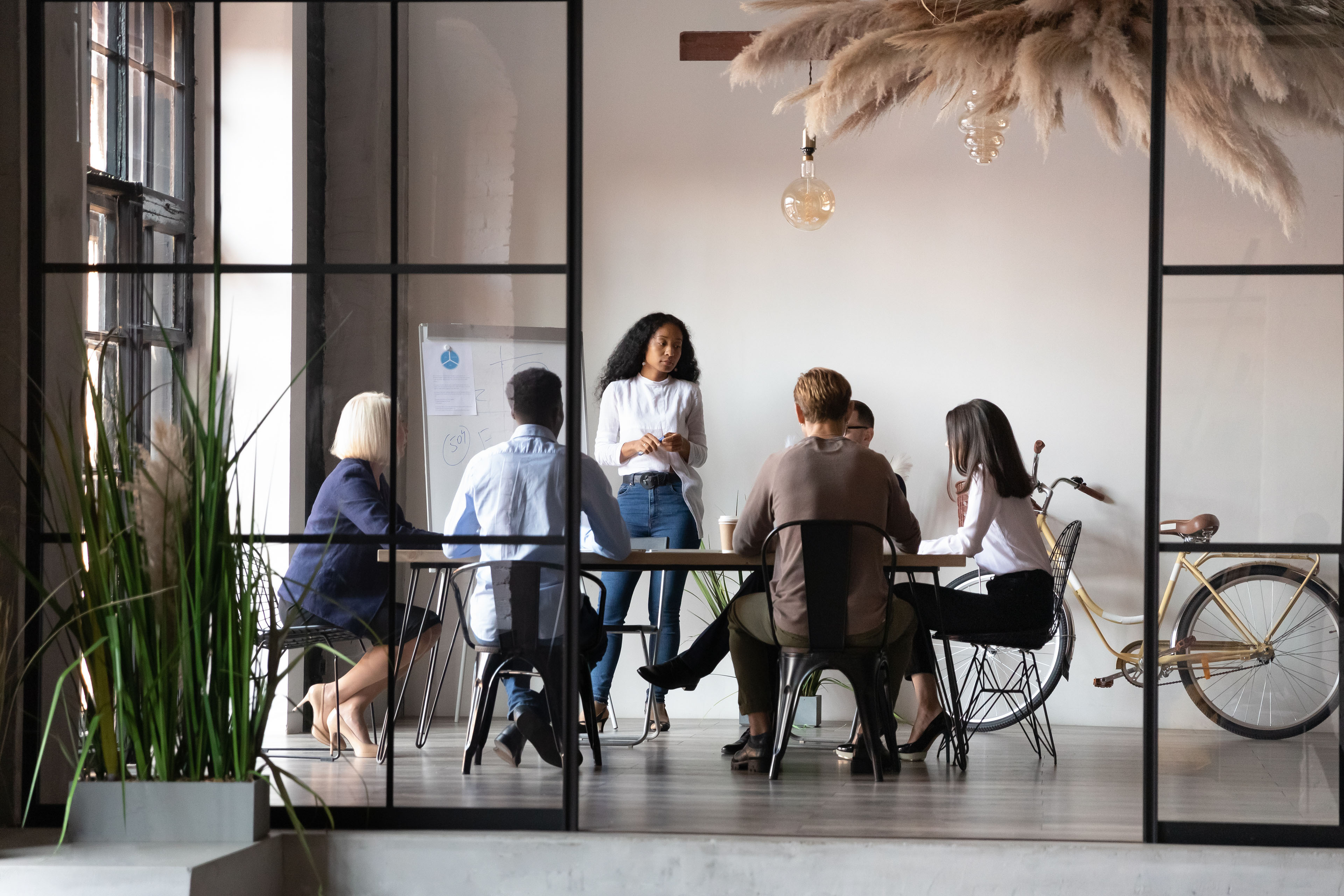 Diverse business people negotiating at group meeting