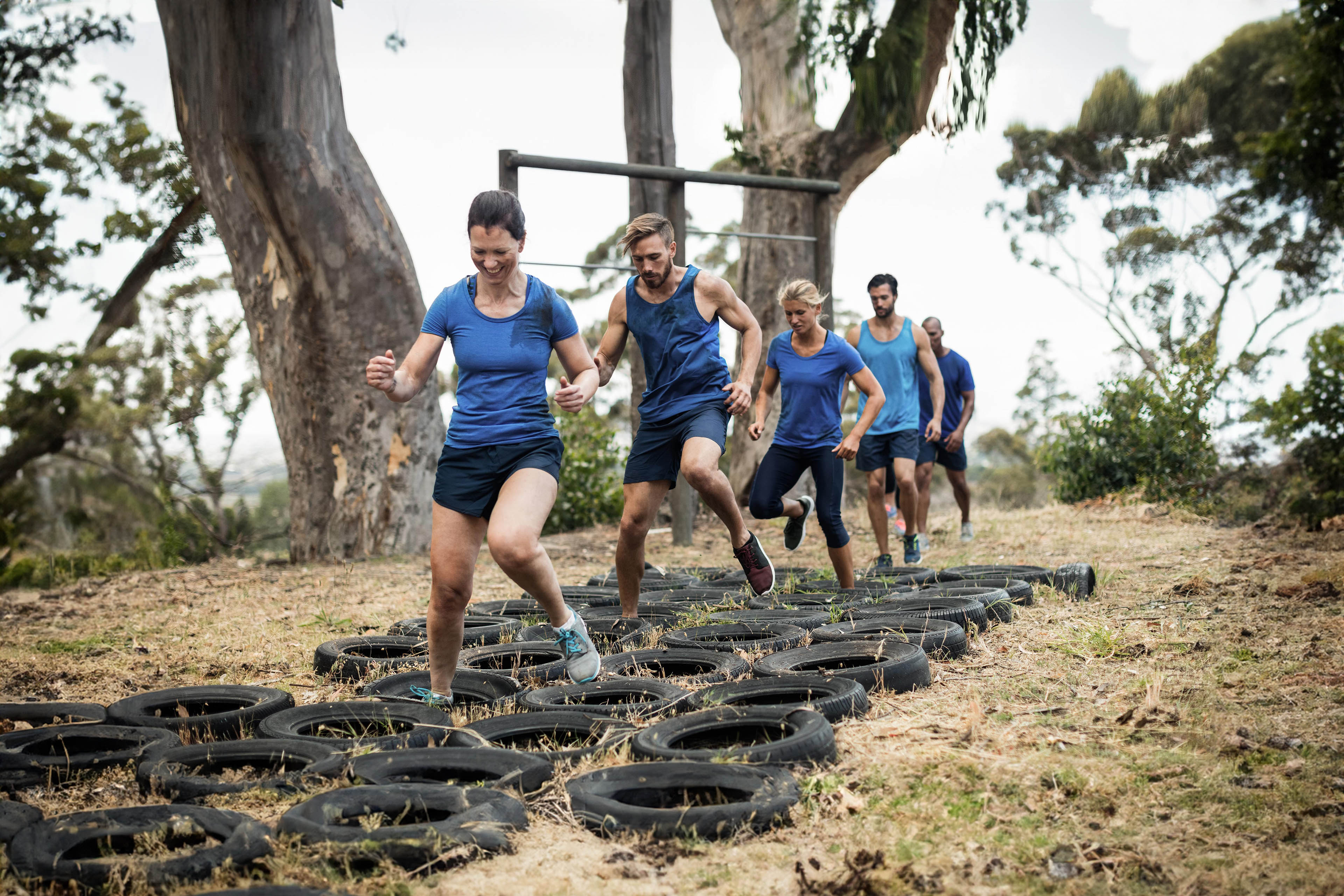 people receiving tire obstacle course training