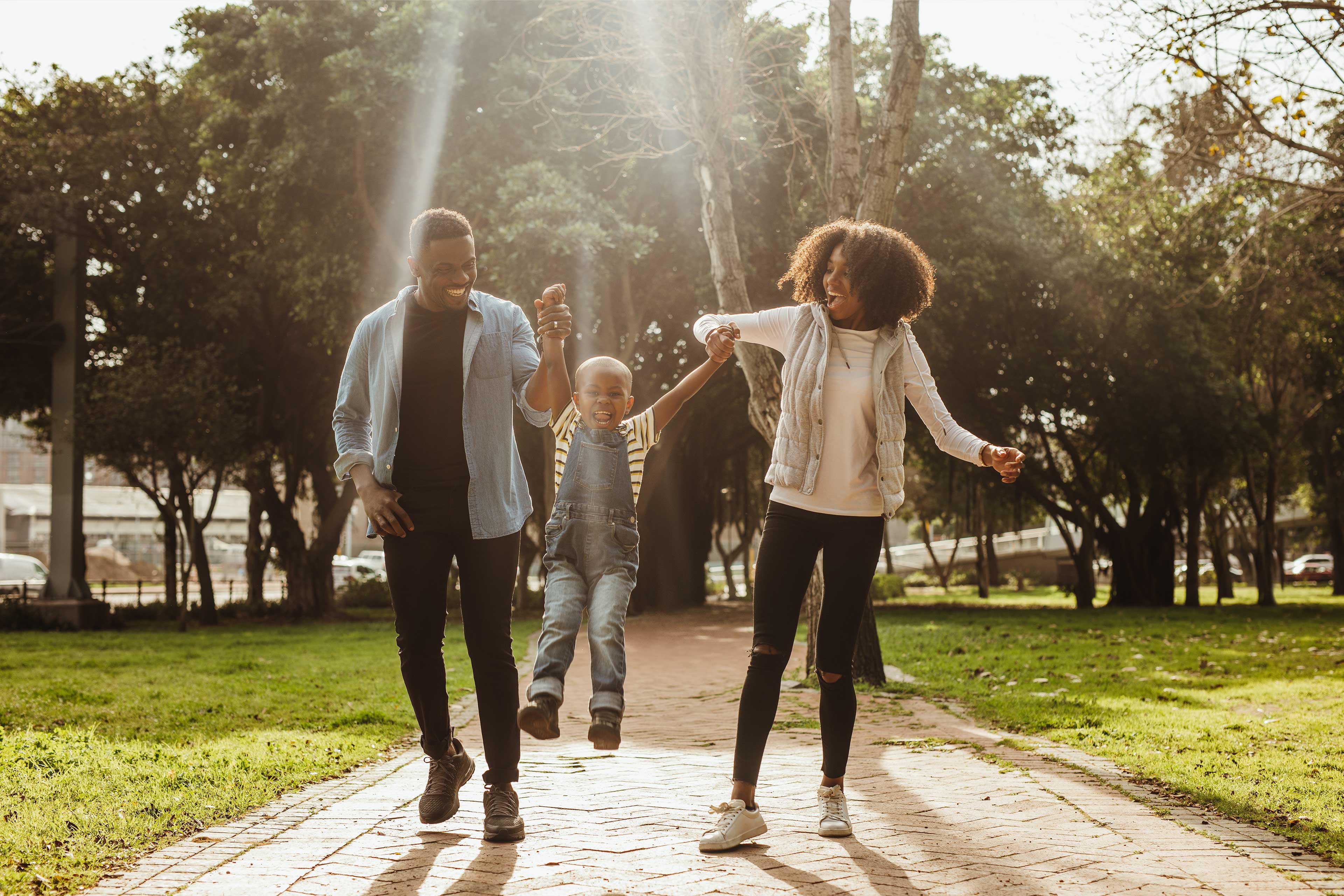 Young family having fun together at park