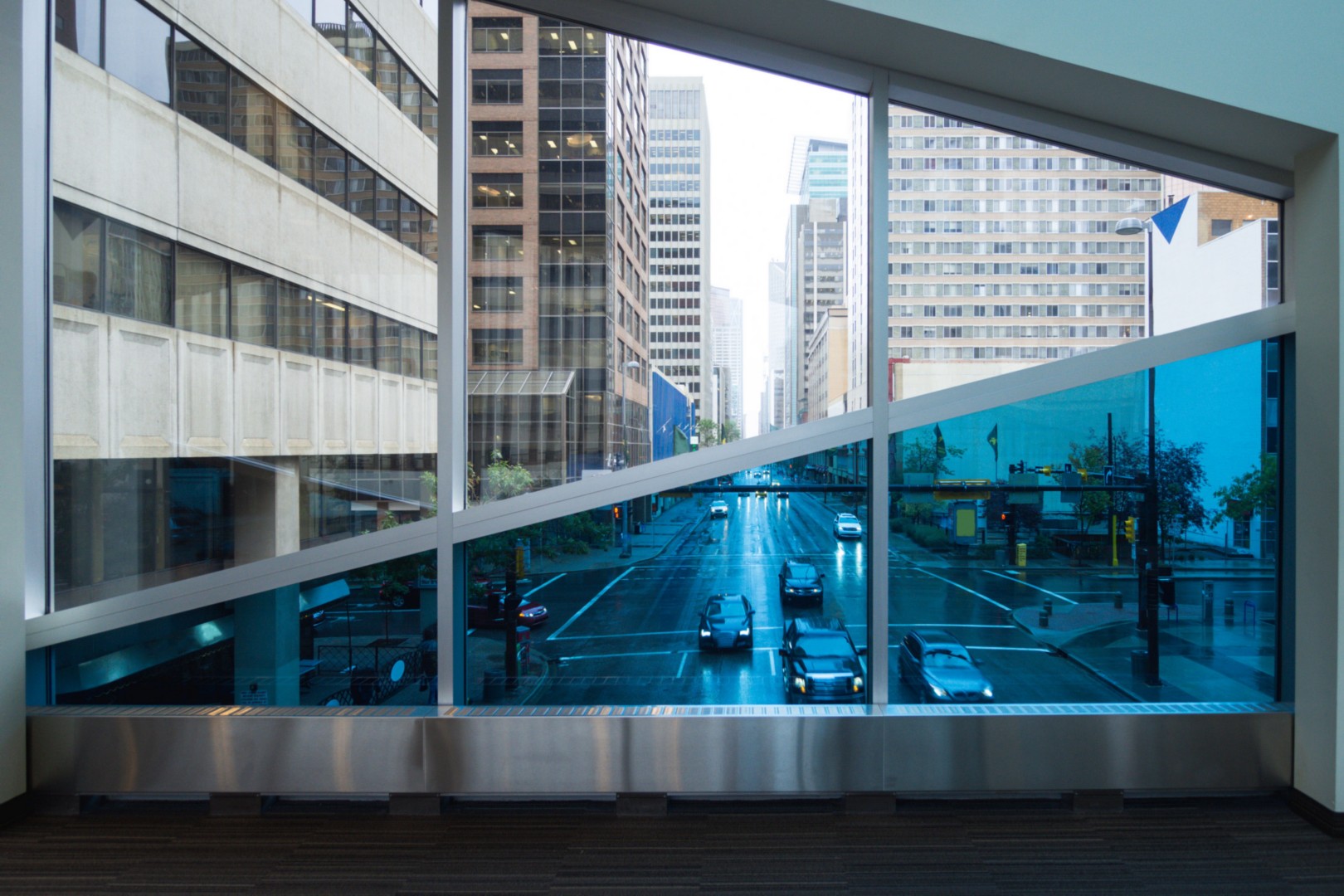 Downtown street from skywalk tinted window