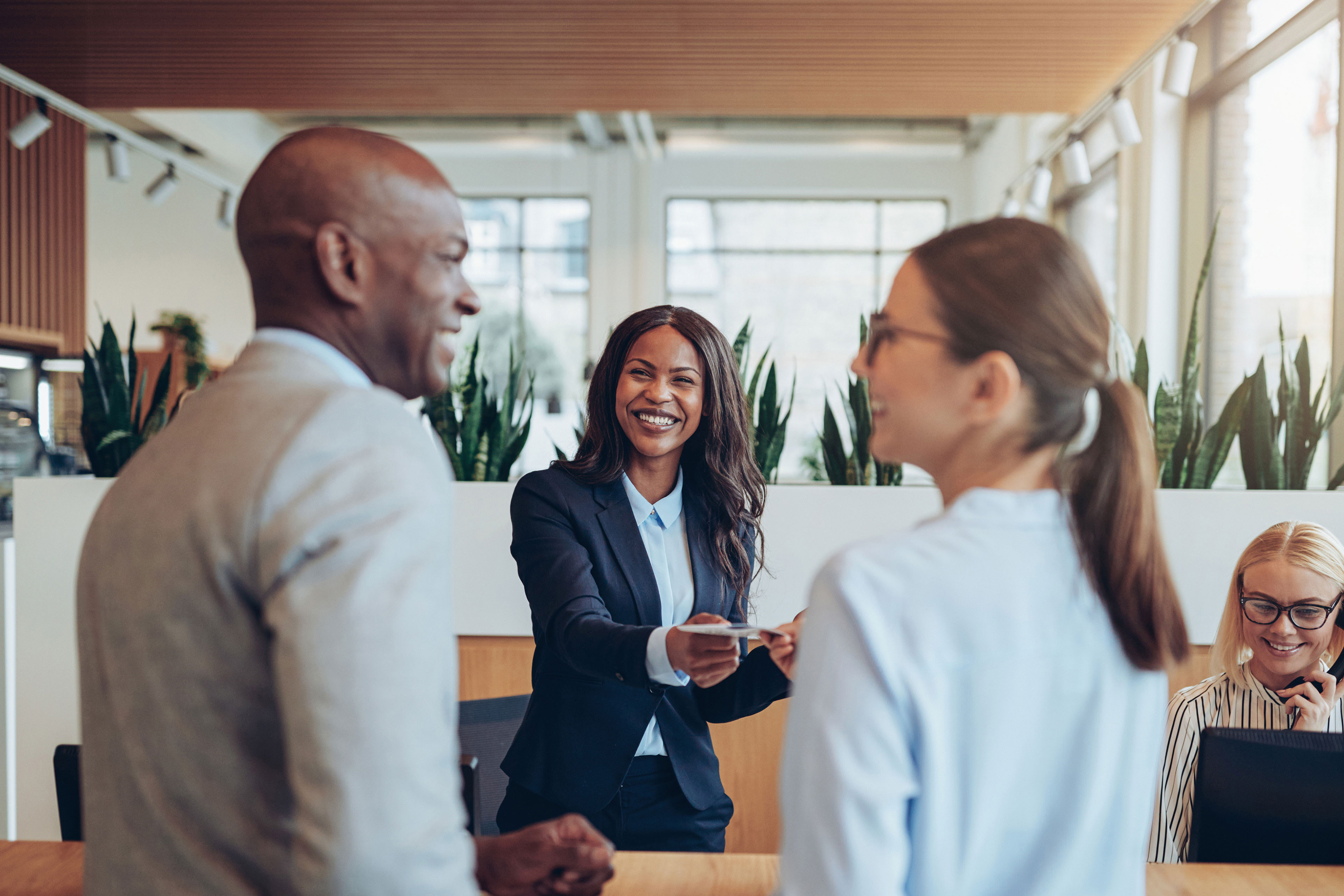 Smiling concierge helping hotel guests