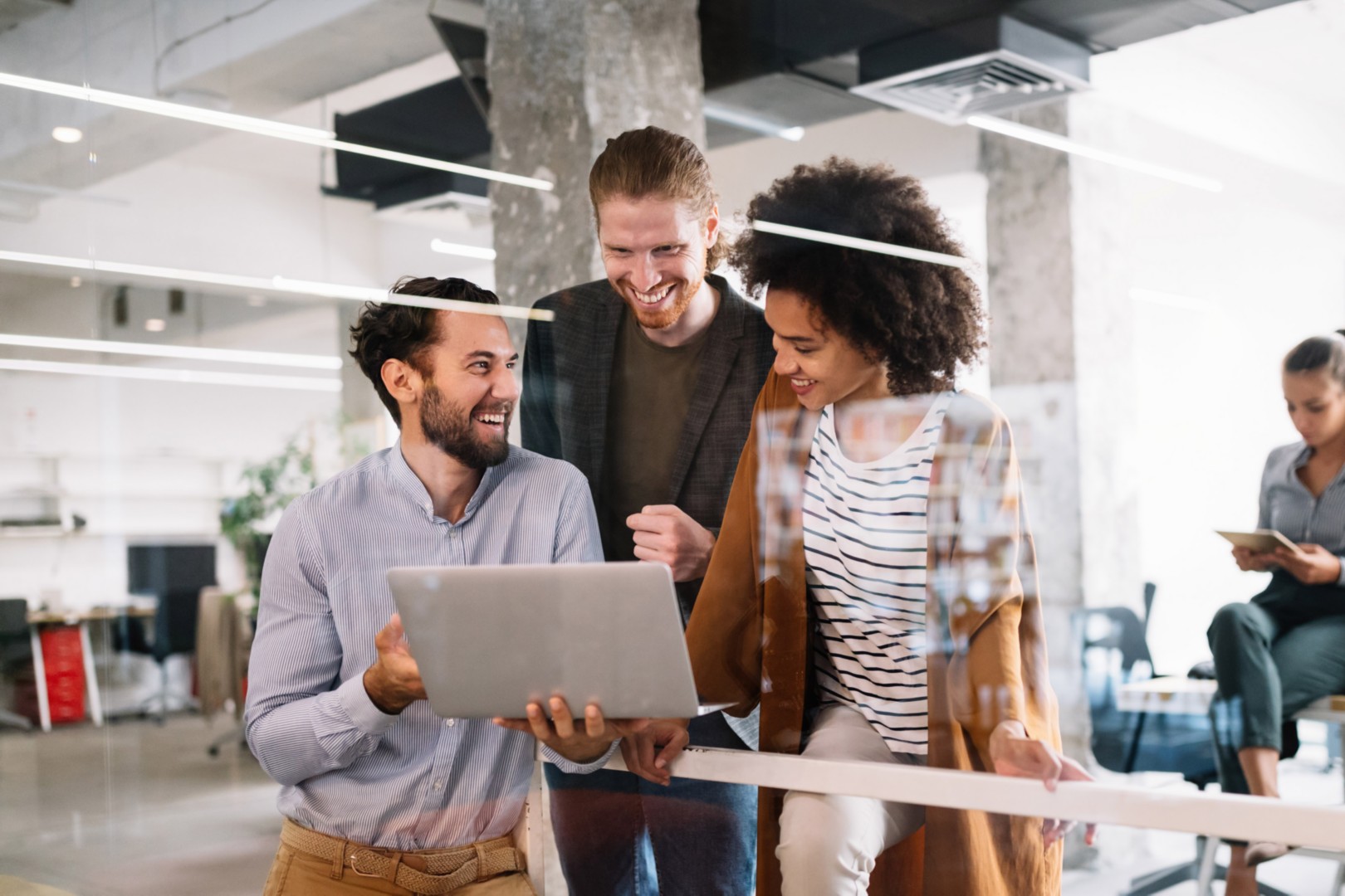 Cheerful coworkers in office during company meeting