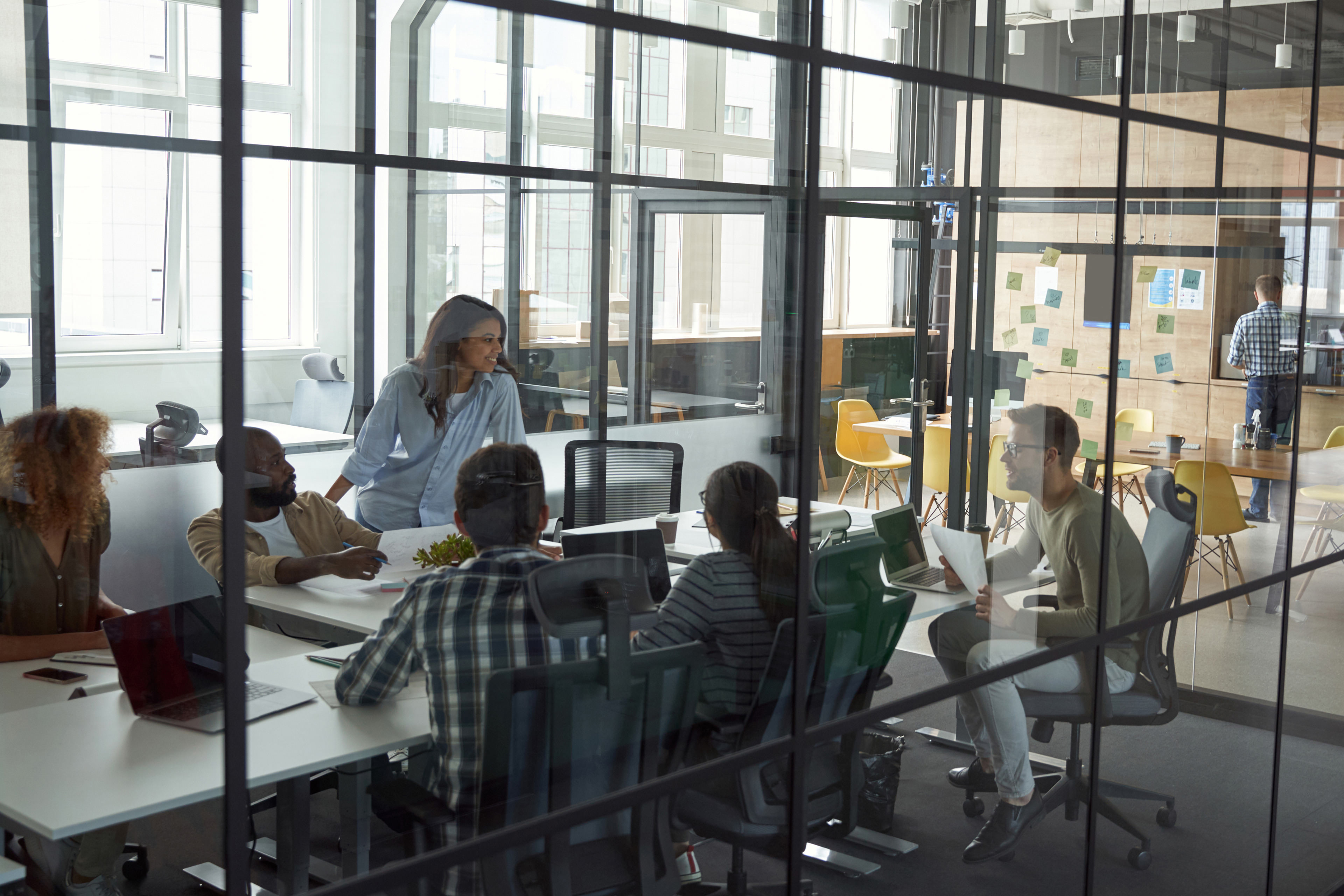 Group of multiracial people working in modern coworking space