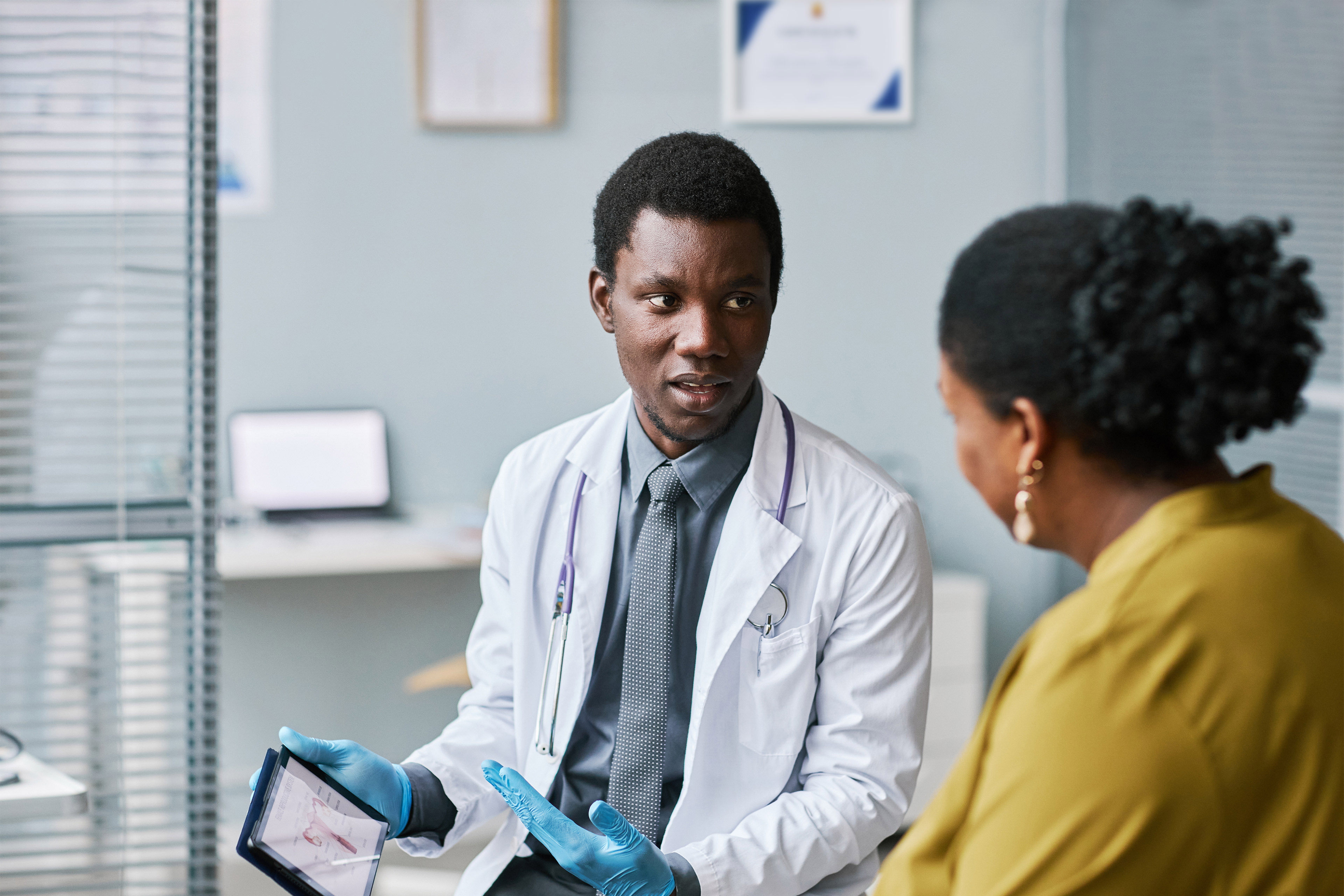 Medical professional talking to patient