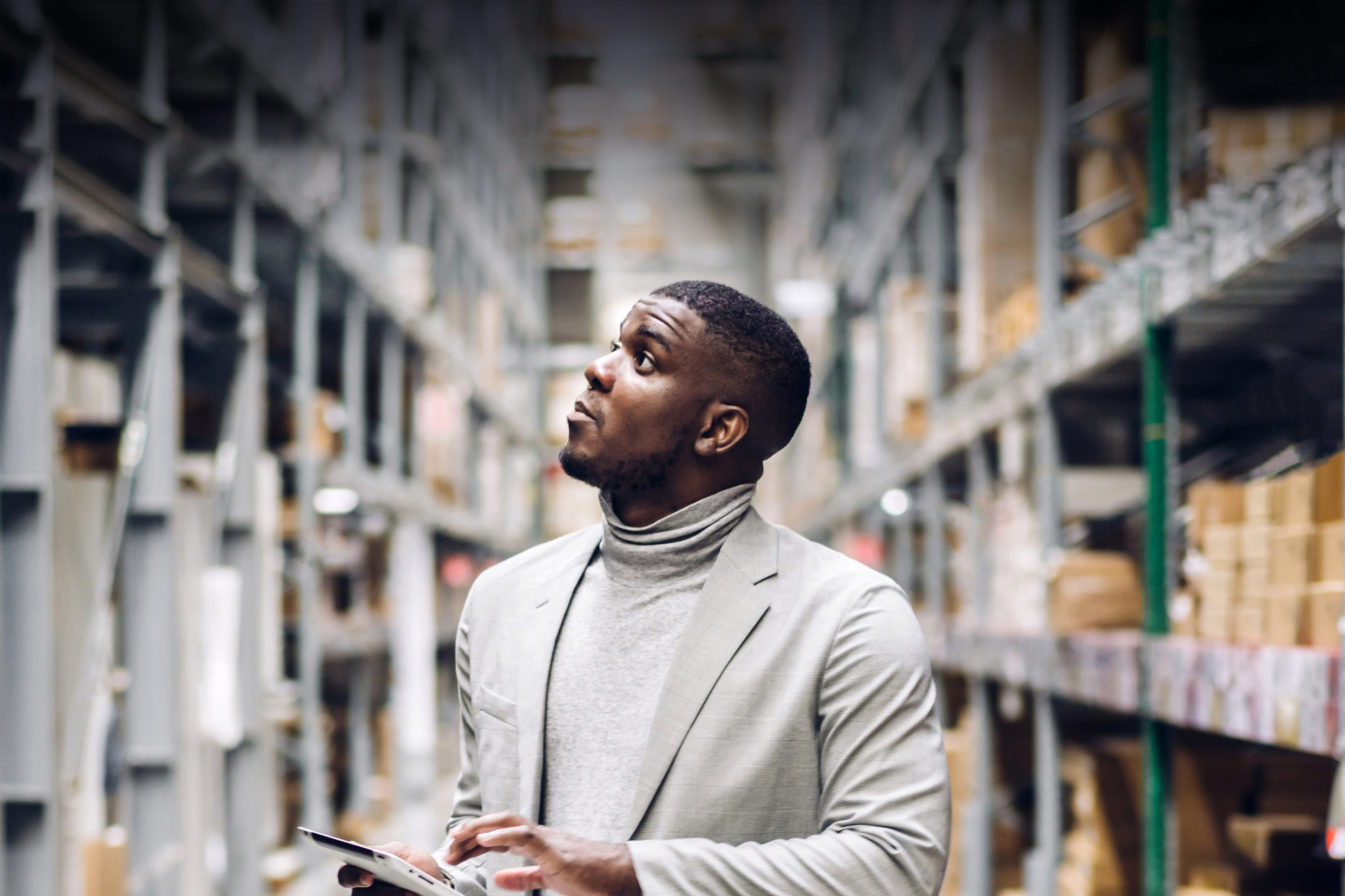 African American man checking details on tablet