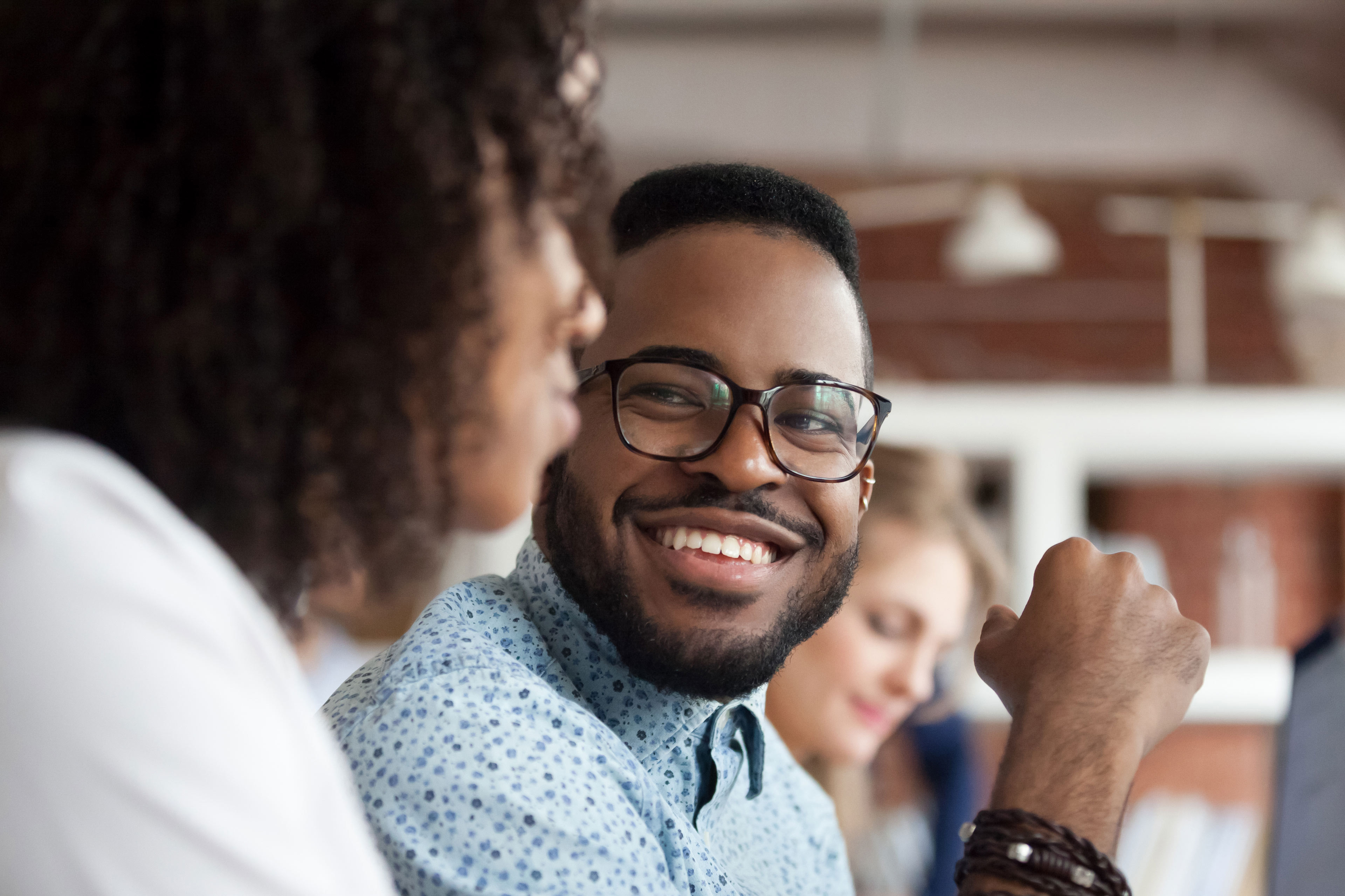 African American male chatting with a colleague