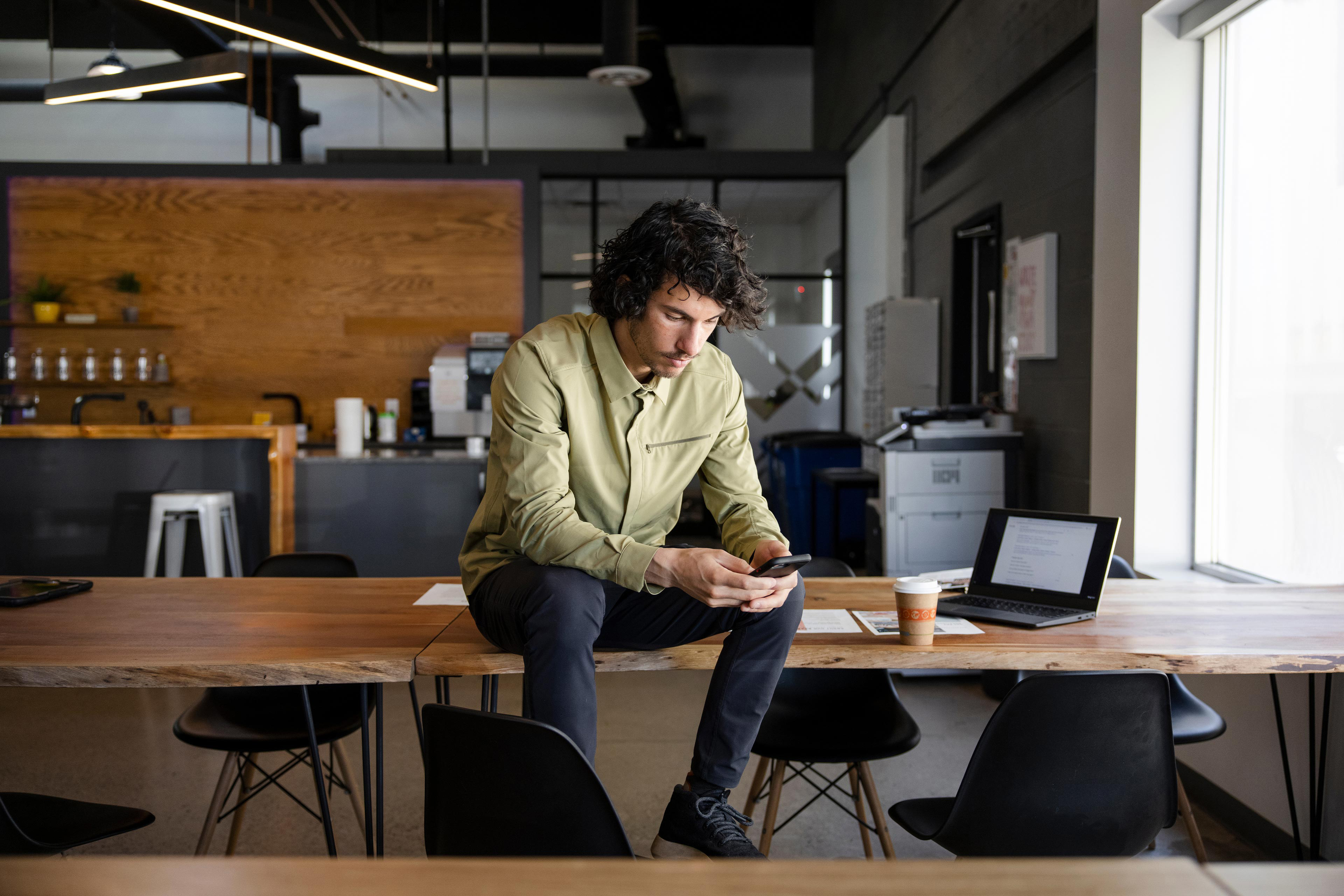 Businessman taking a break with phone