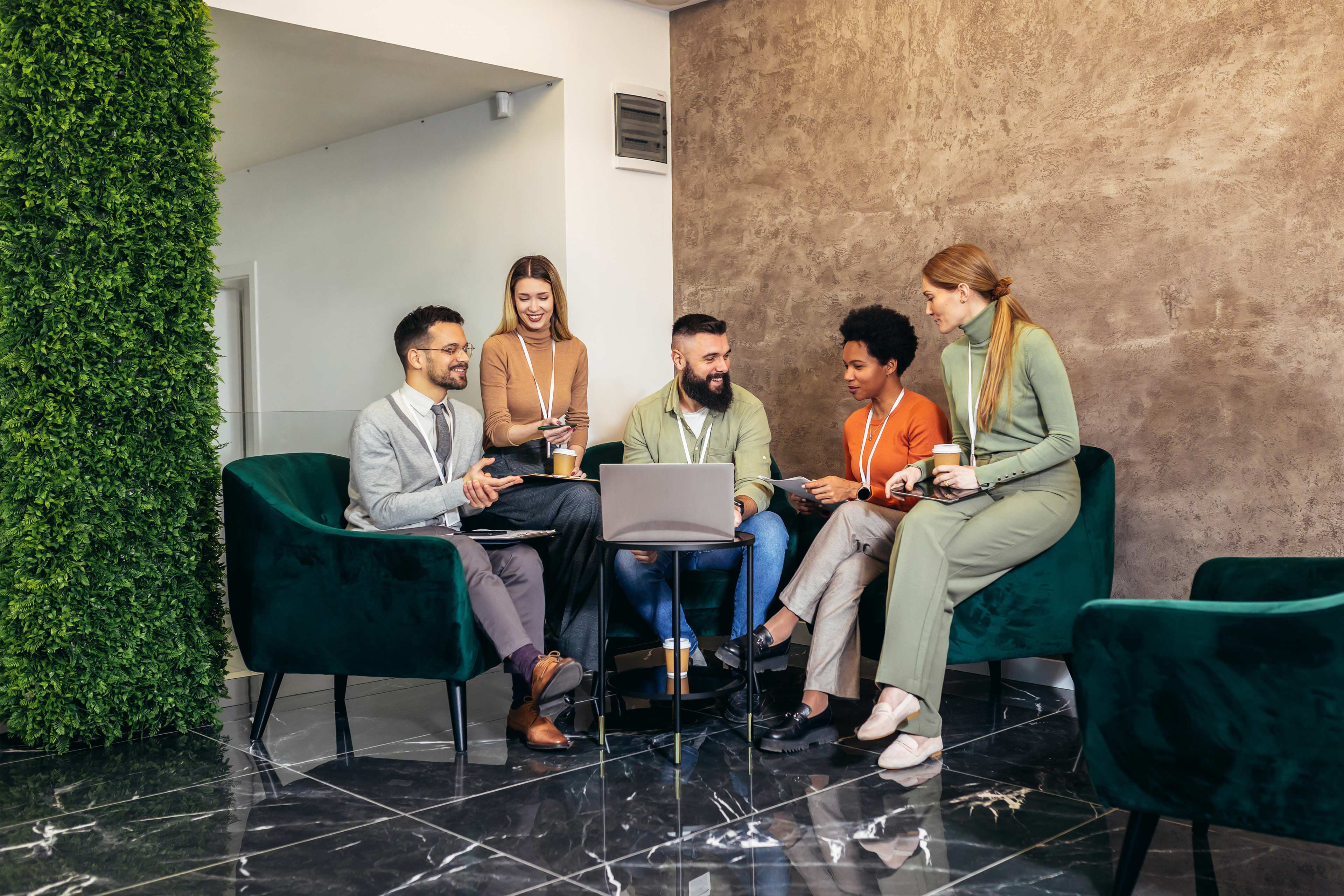 Businesspeople working in an office lobby