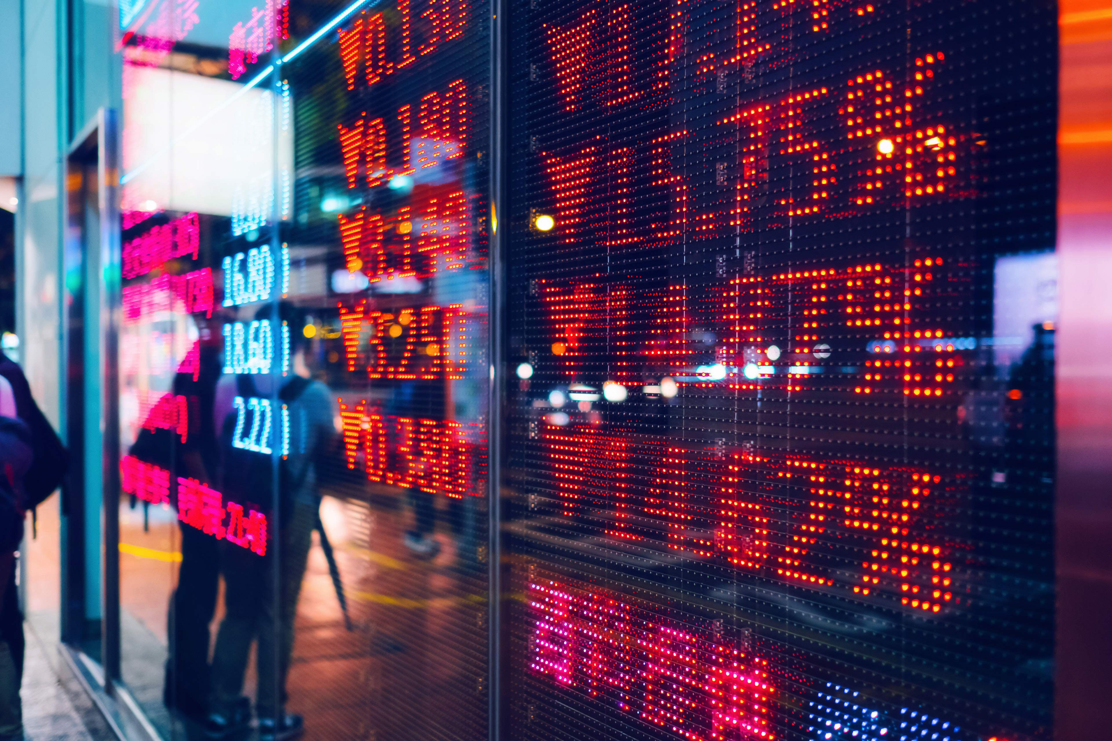 Stock exchange market display screen board on the street showing stock market crash sell-off in red colour