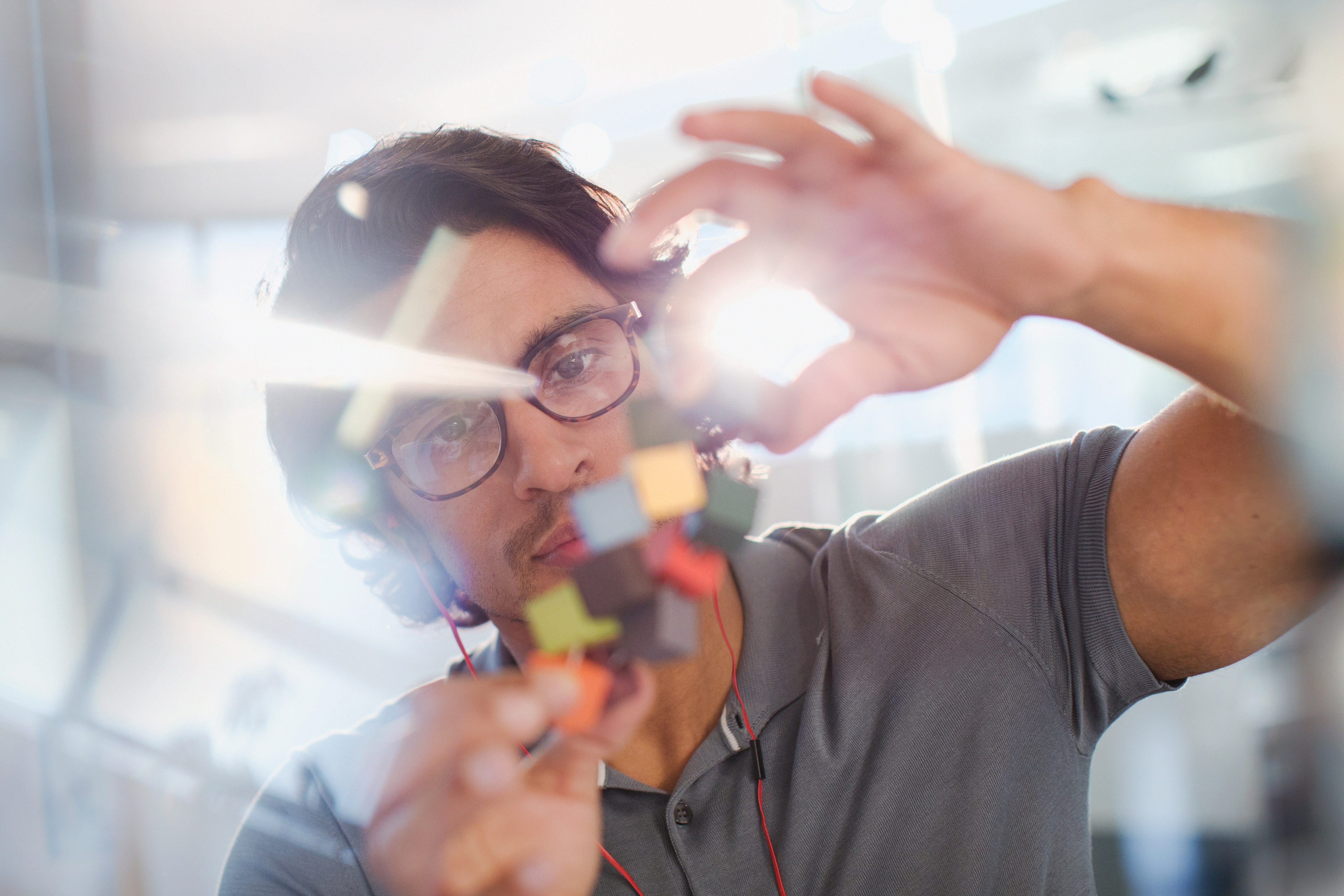 A young man fixing circuit