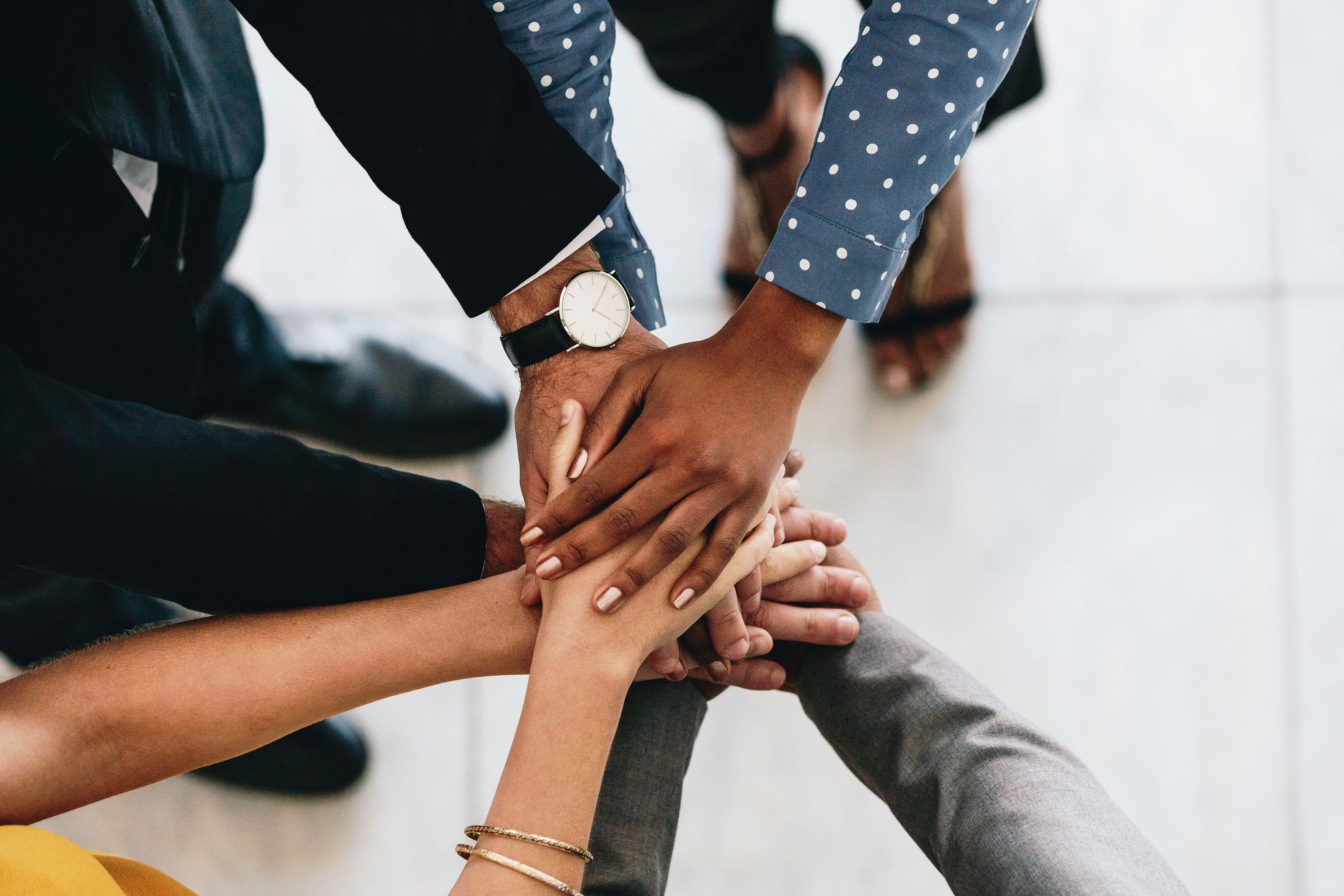 Diverse hands meeting together