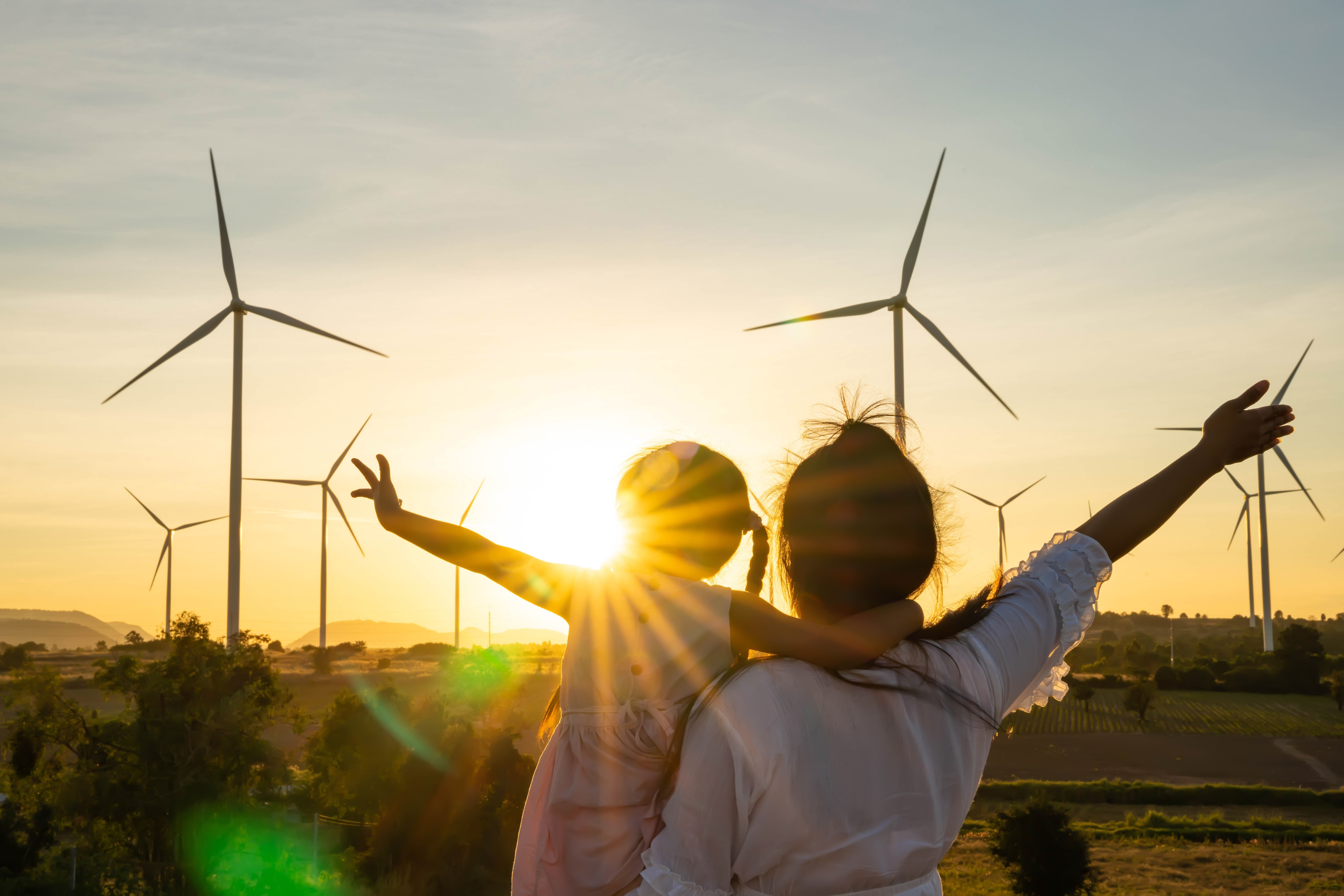 Mom and child at wind turbines