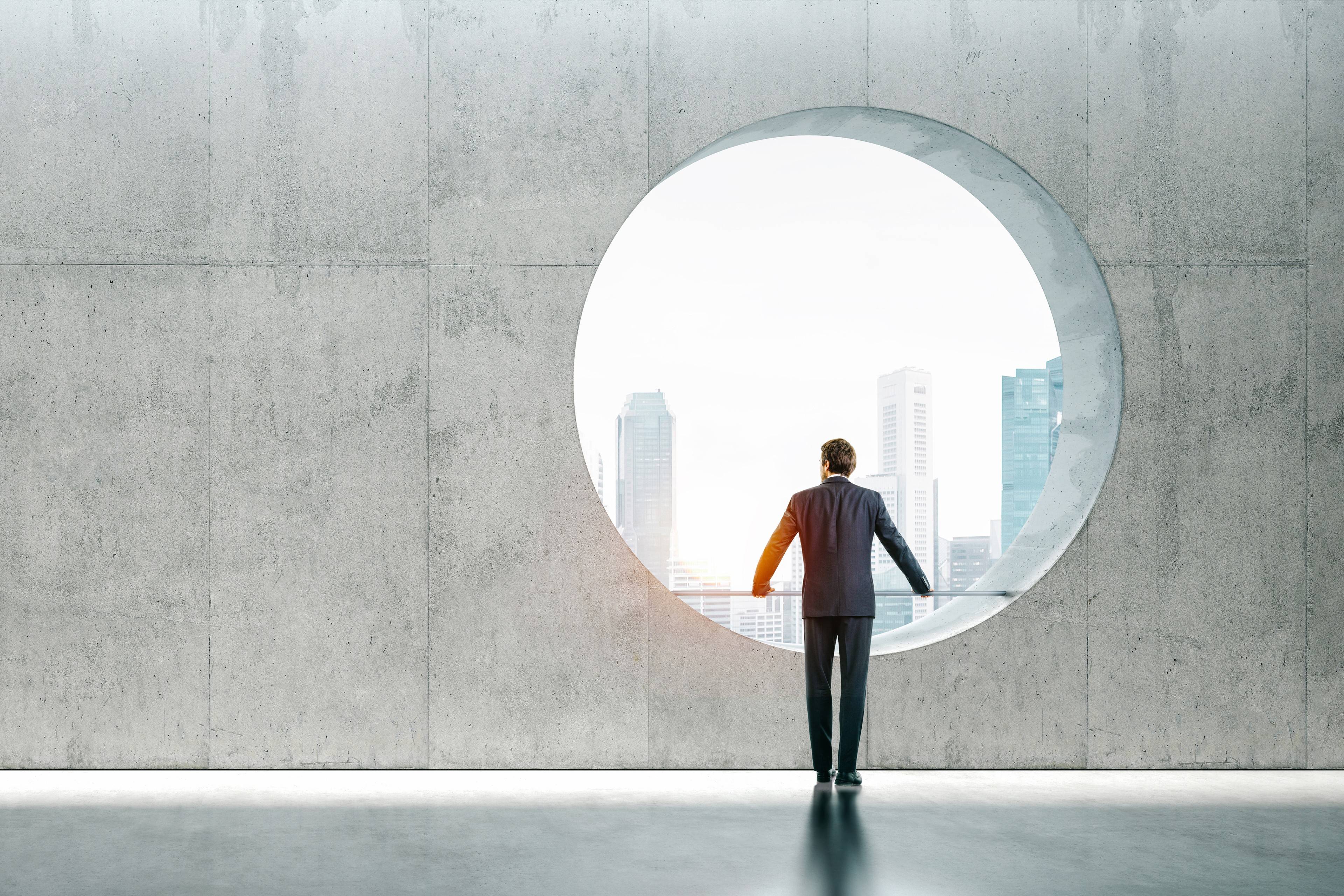 Man looking through wall