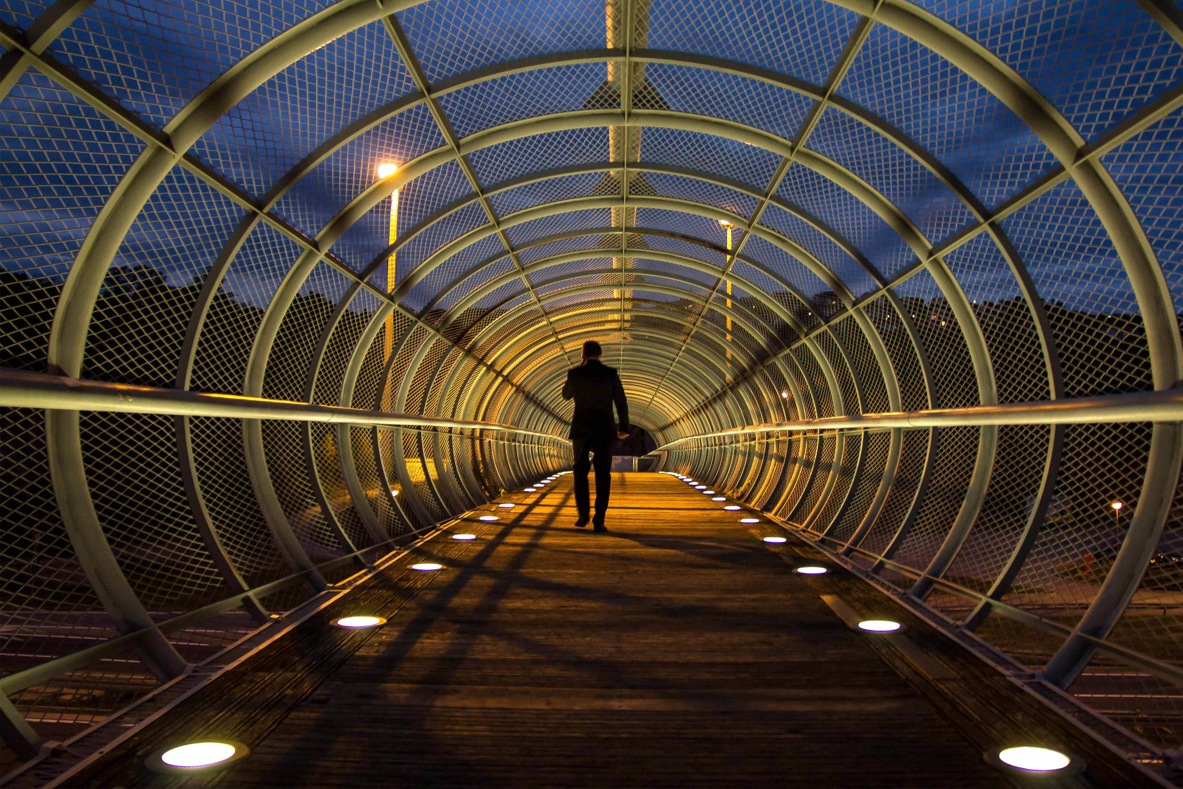 EY Person Standing on Bridge