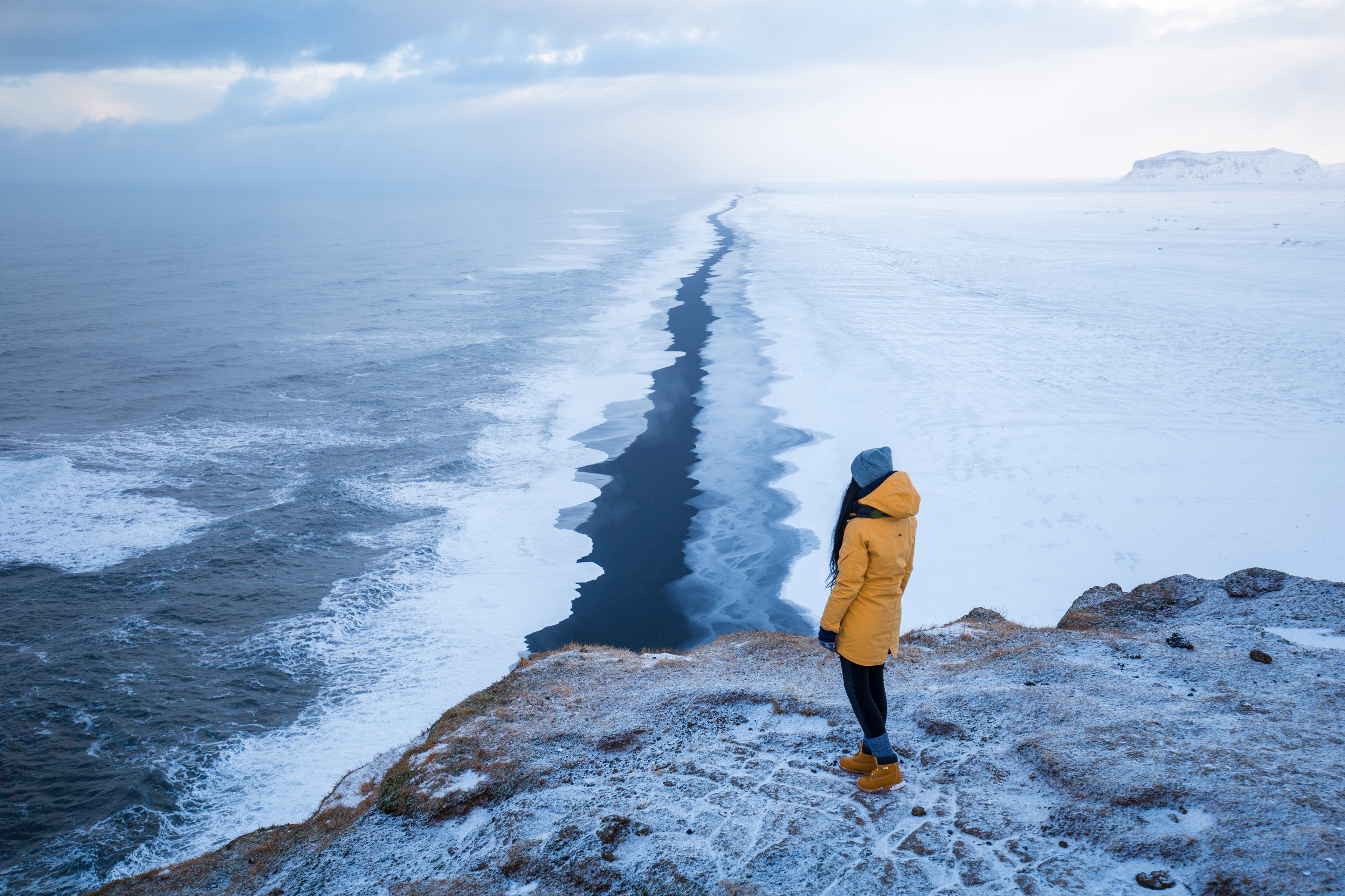 Endless black beach in winter