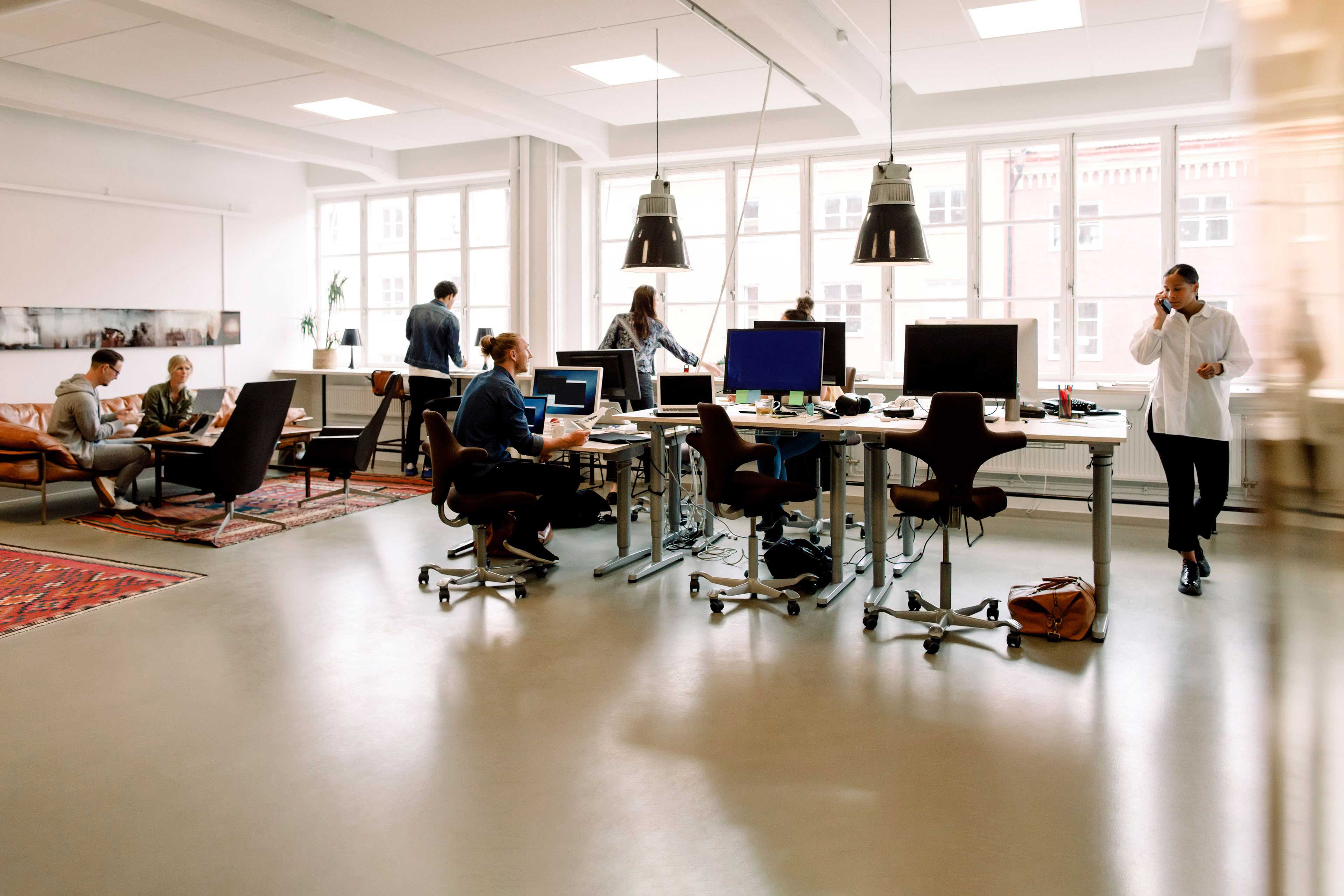 ey-male-and-female-entrepreneurs-working-in-creative-office