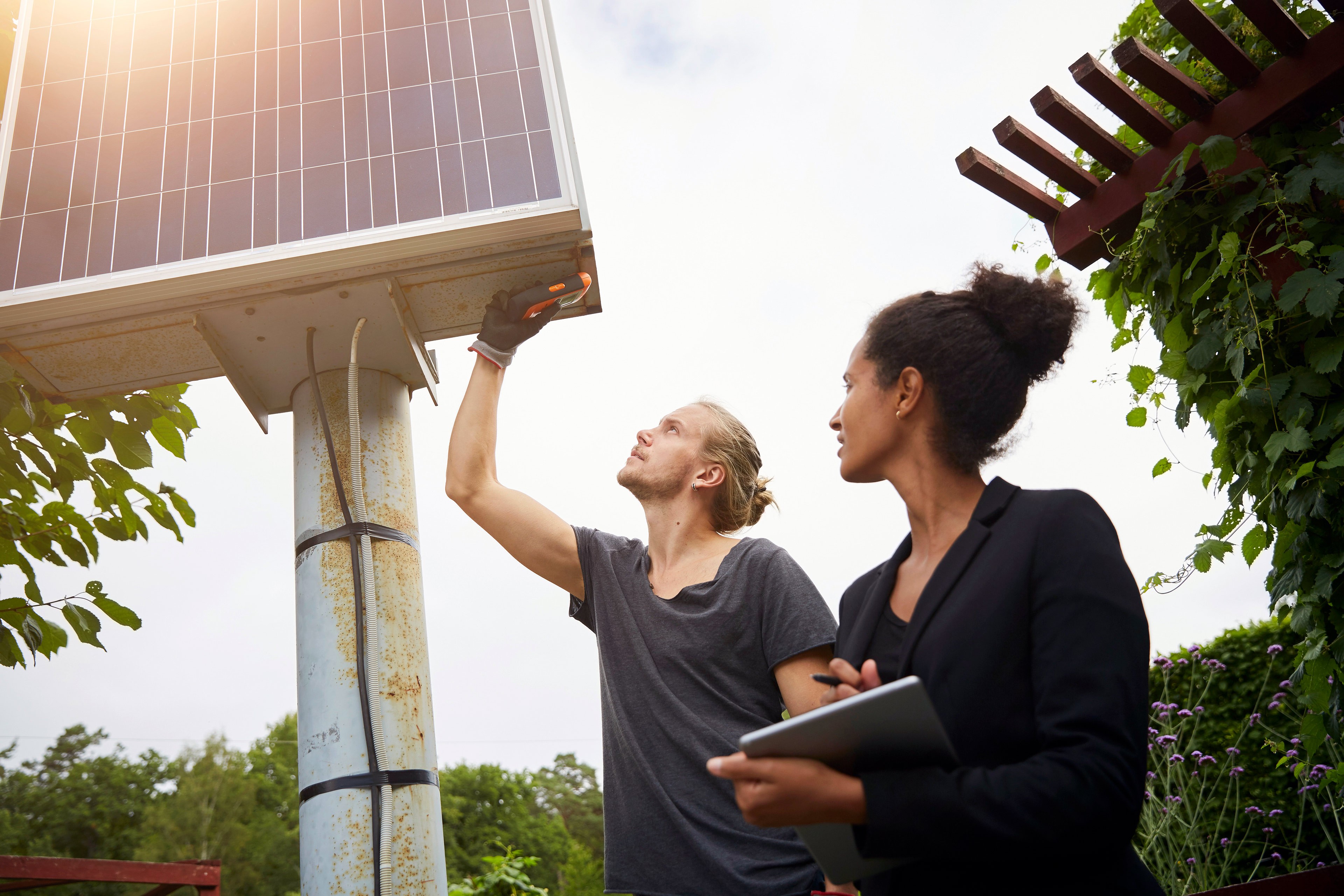 Man and woman looking at solar system