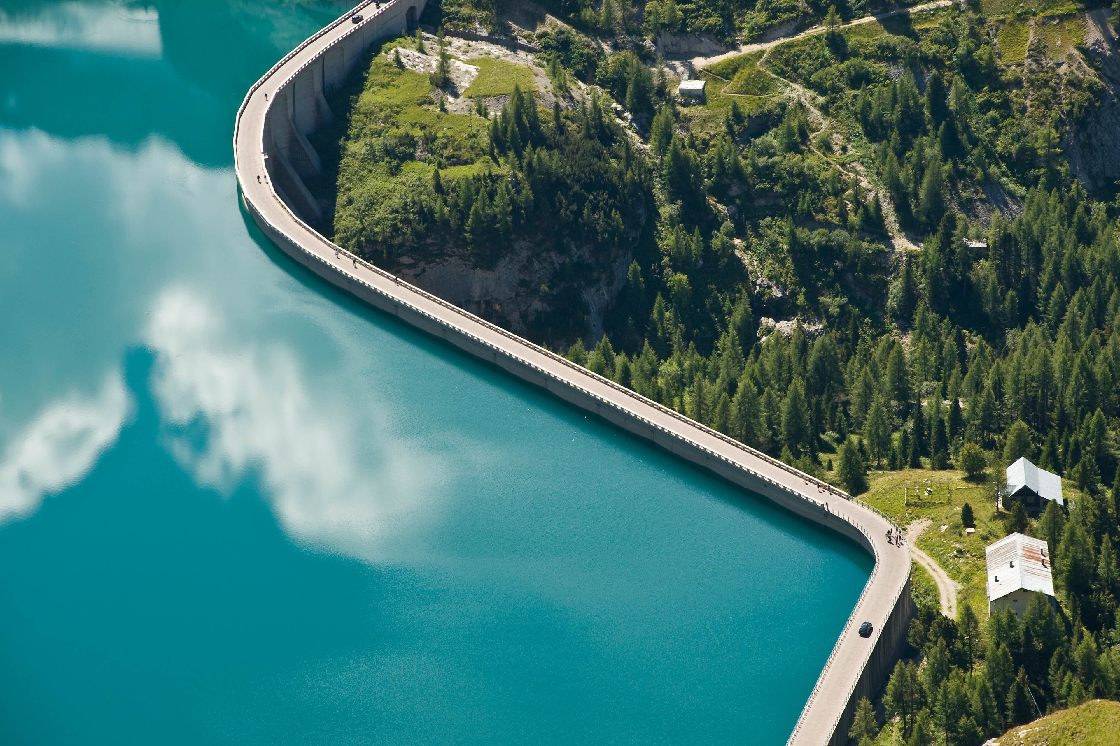 Dam at end of fassa valley in dolomites background