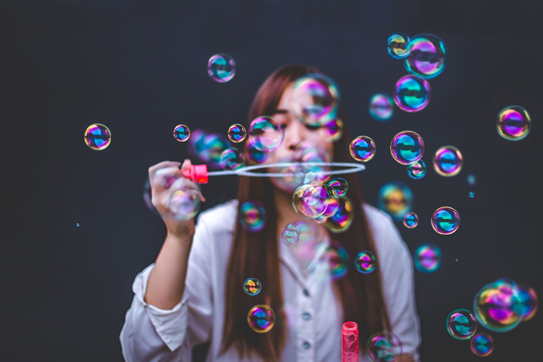 ey-woman-blowing-bubbles