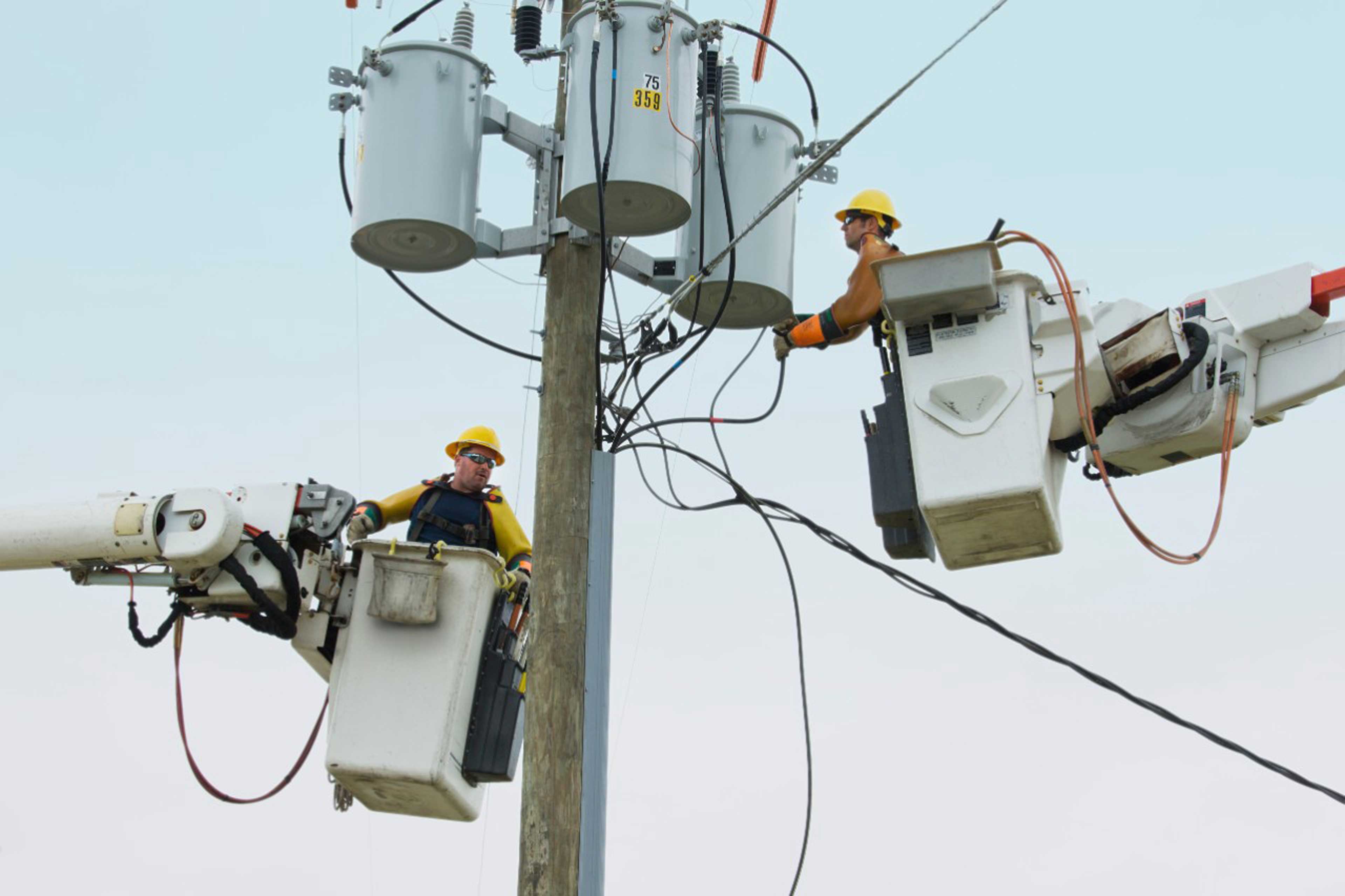 Ey men working with electricity