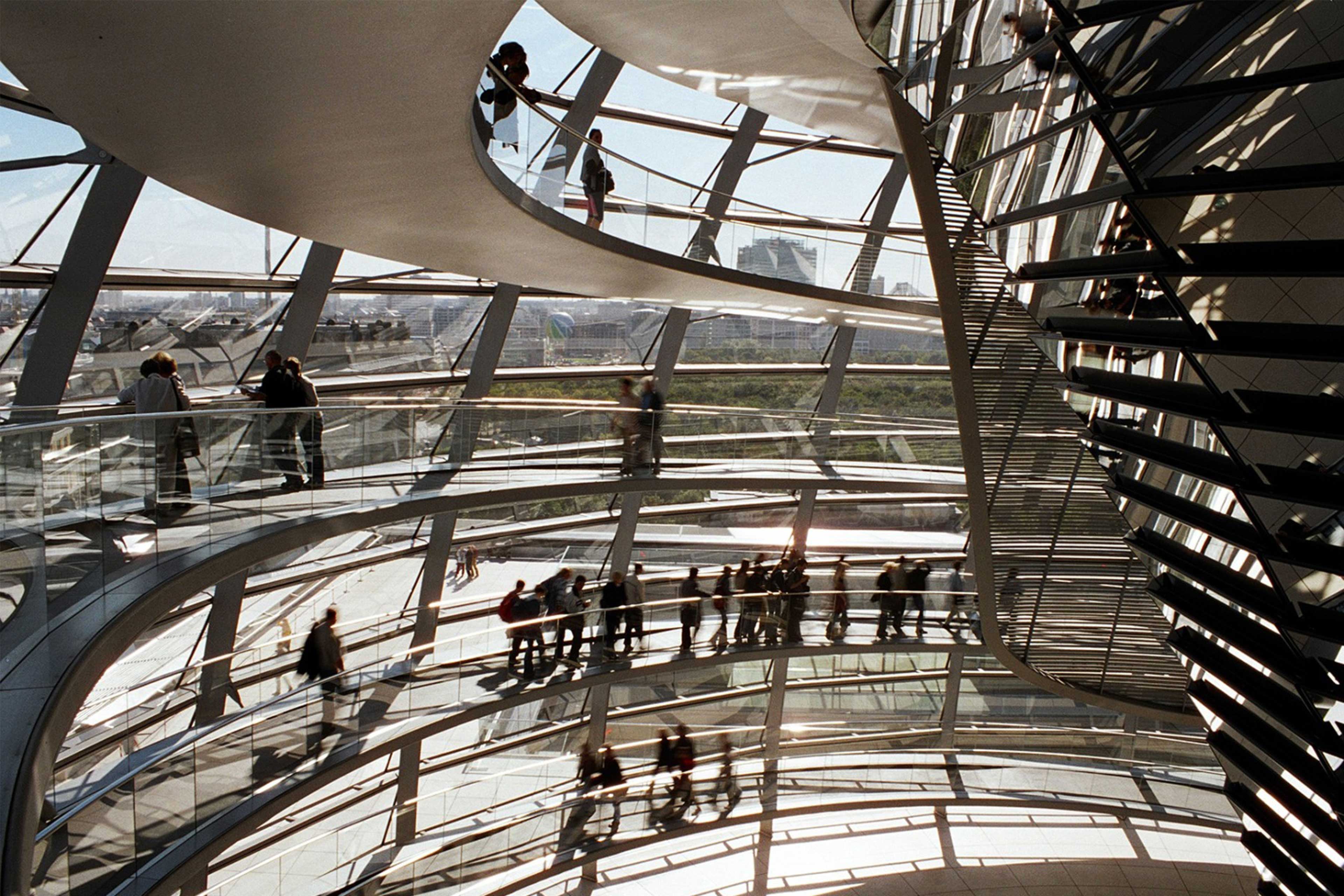 People walking inside building stairs