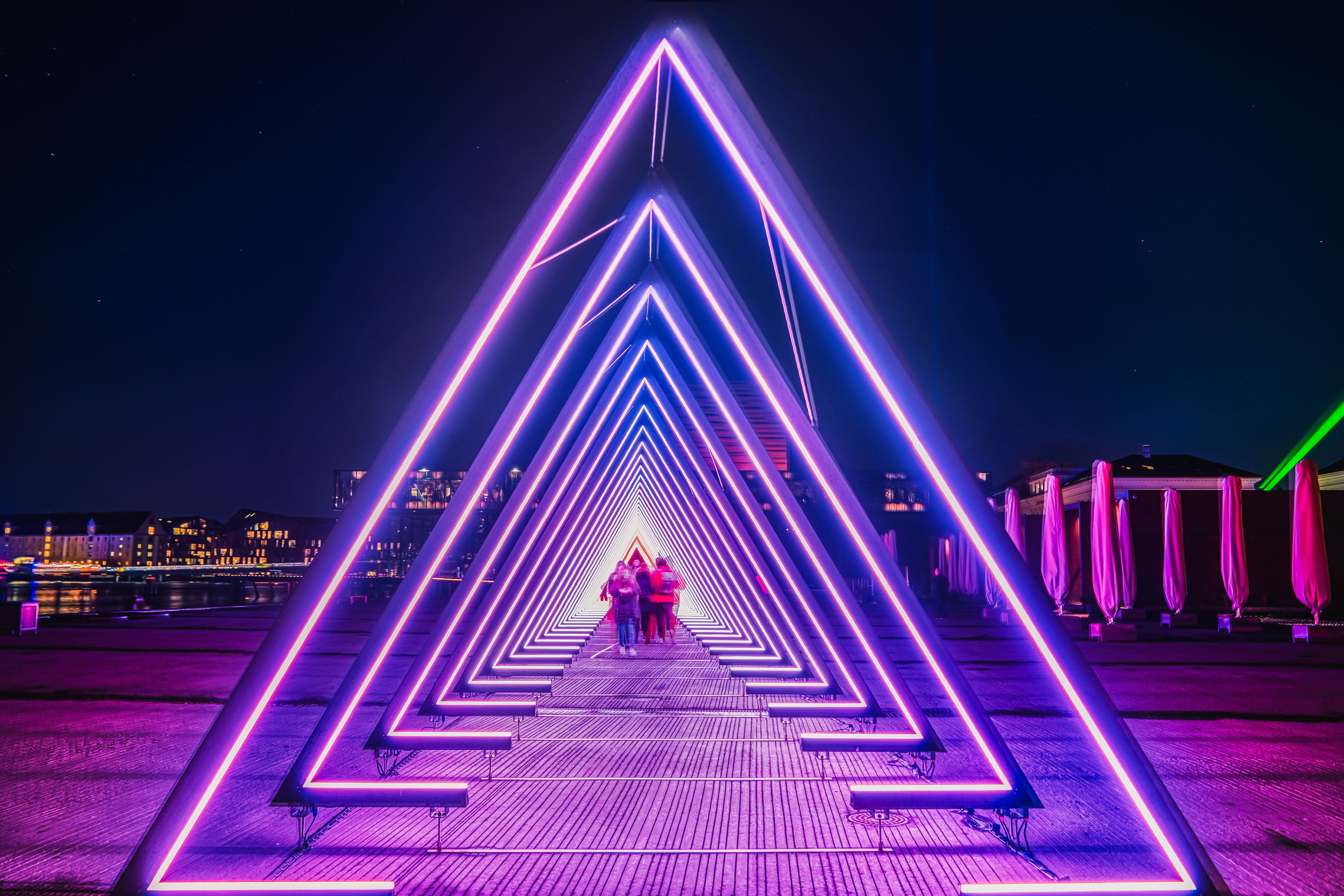 People walk across the deep passage of purple gate of light