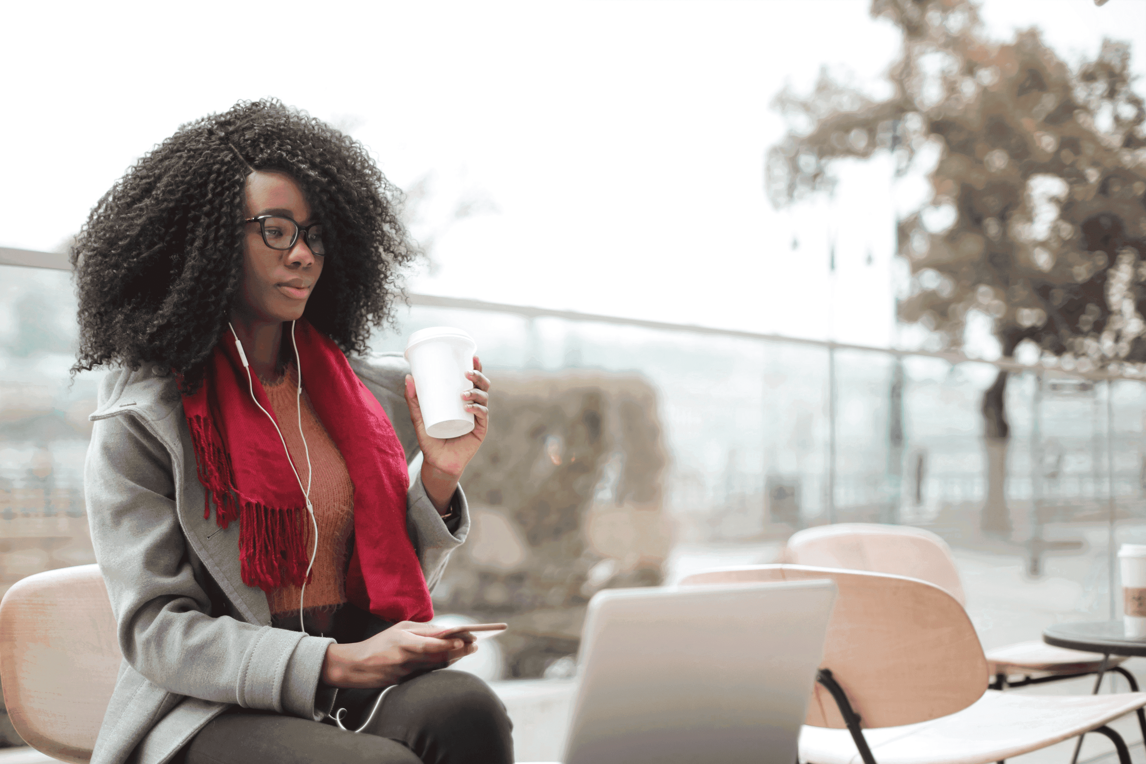 Woman working with laptop and listening music  