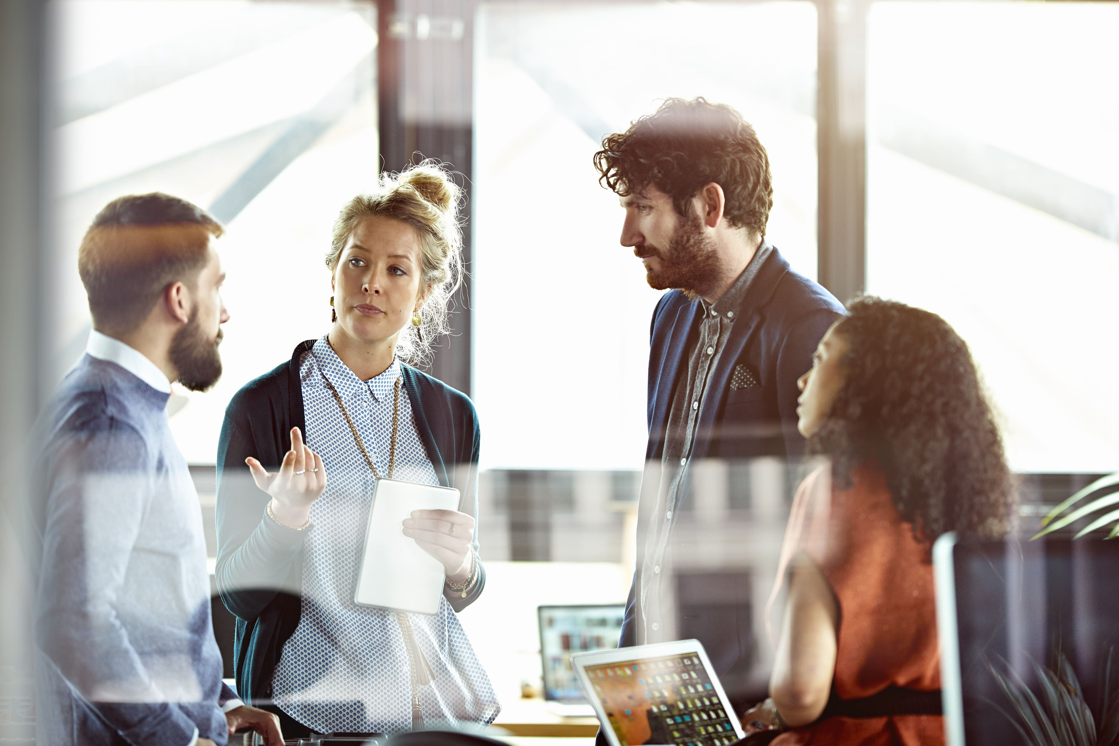 Female leadership discussing with employees