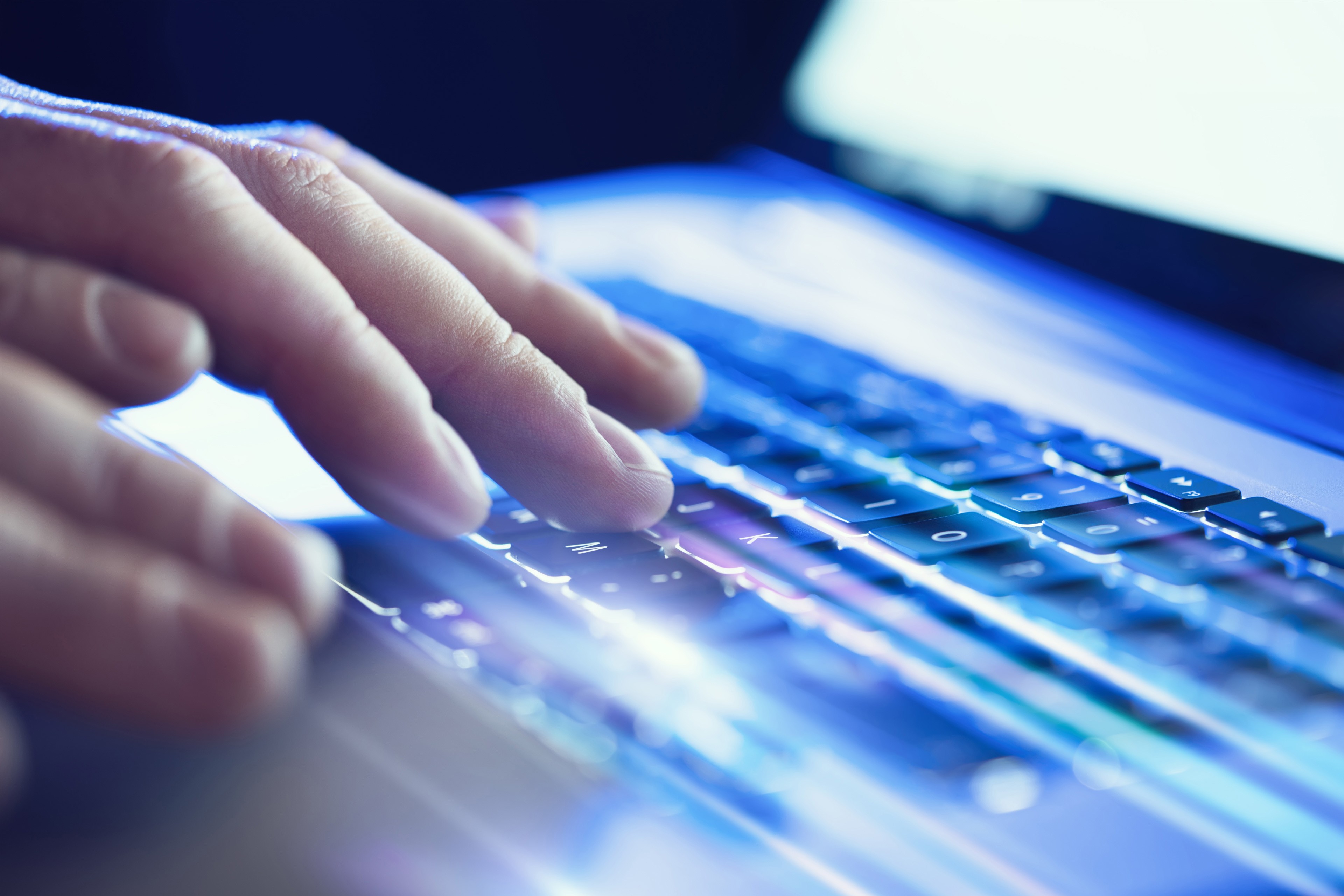 closeup of hands on keyboard