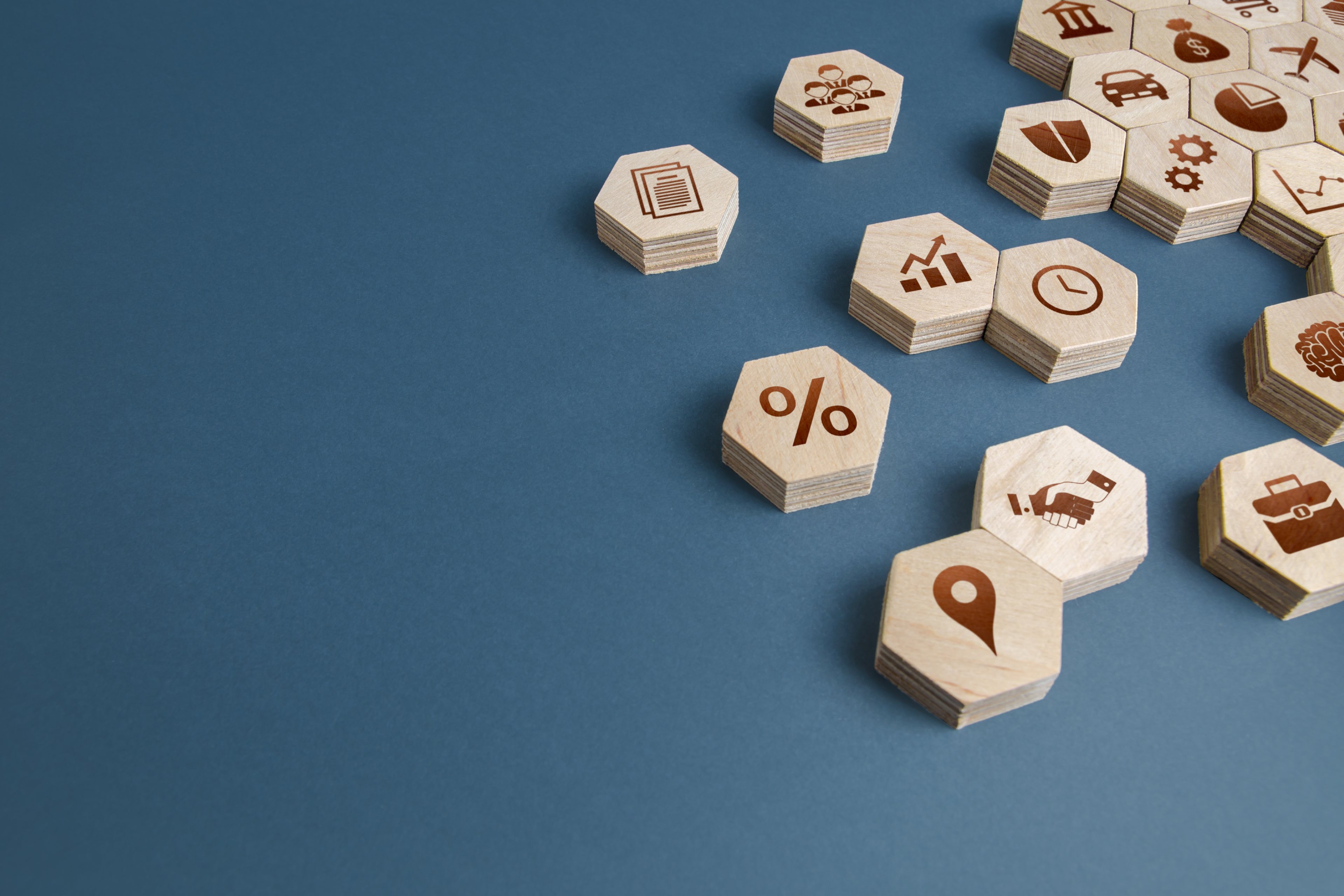 Hexagon shaped wooden coins with symbols on it