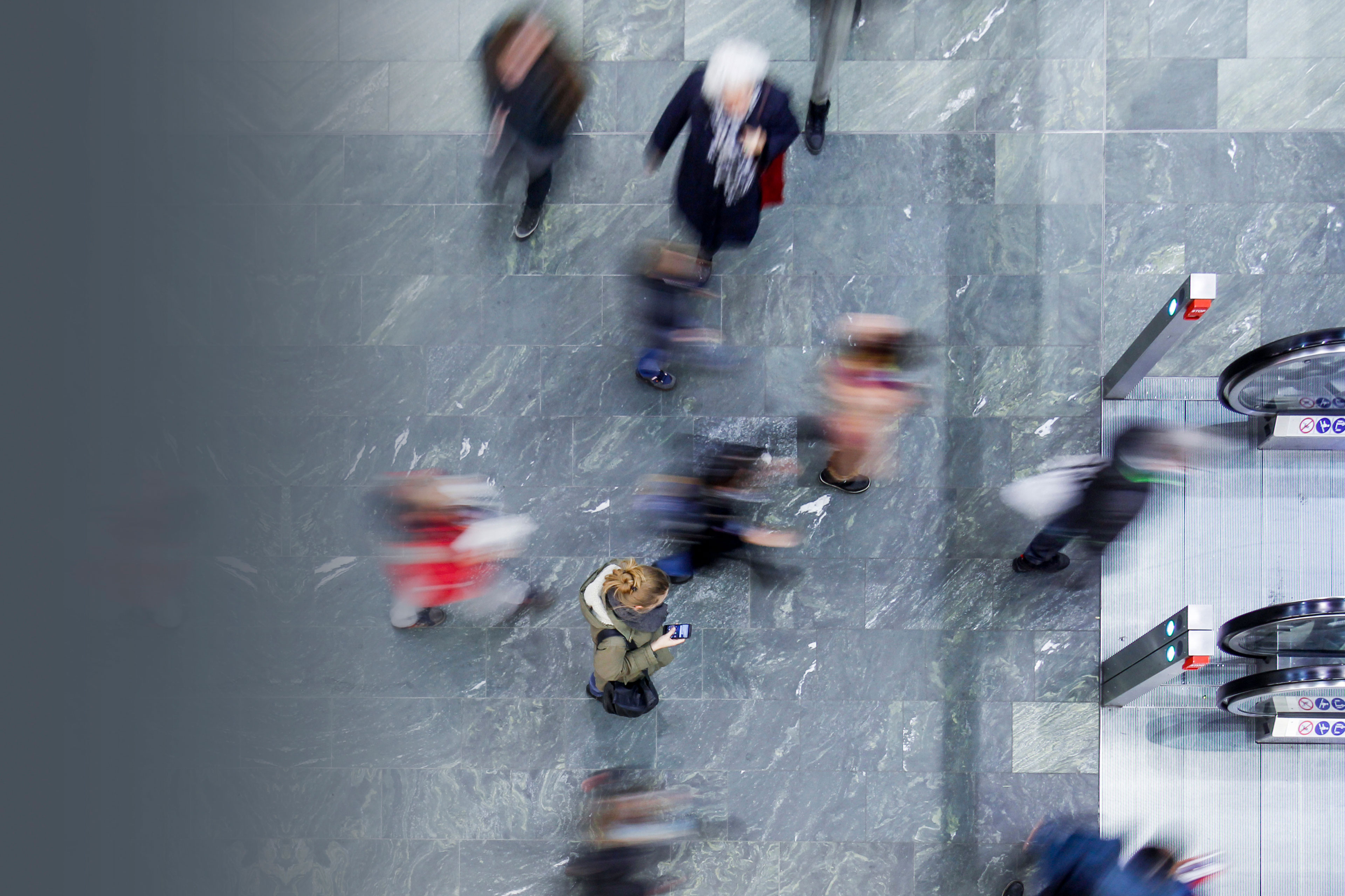 Blur view of people near escalator