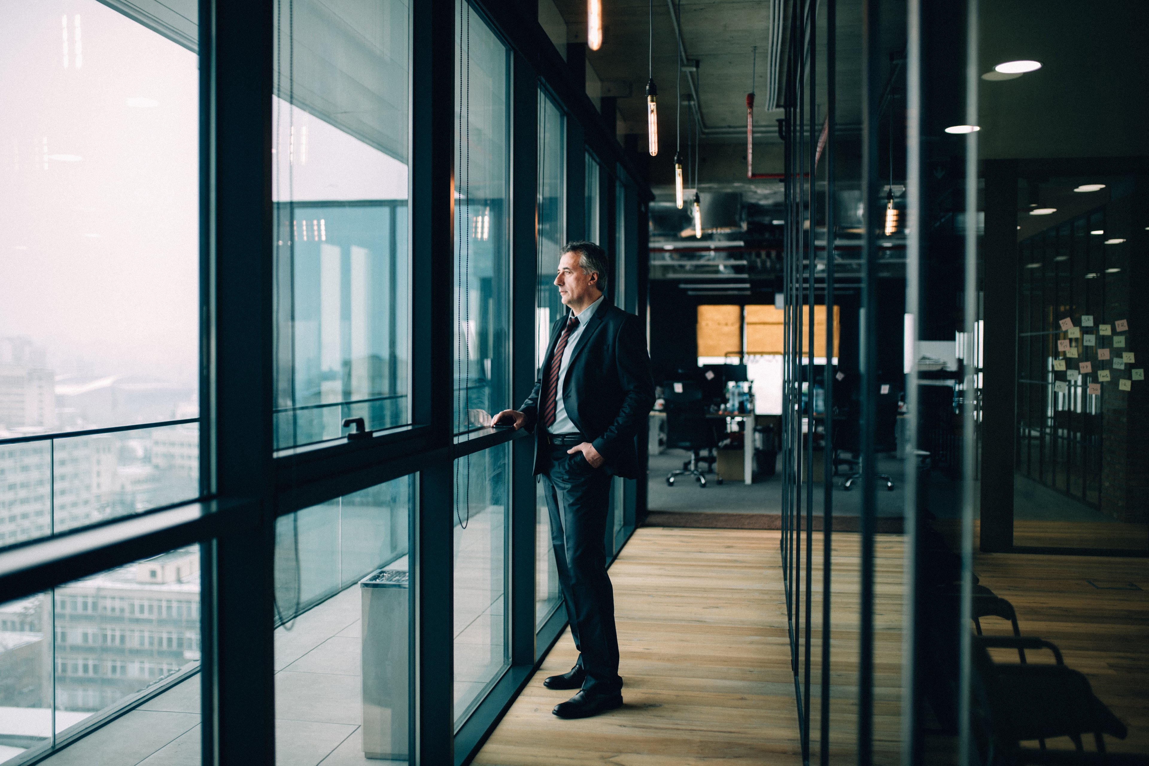 Businessman looking outside from Cabin