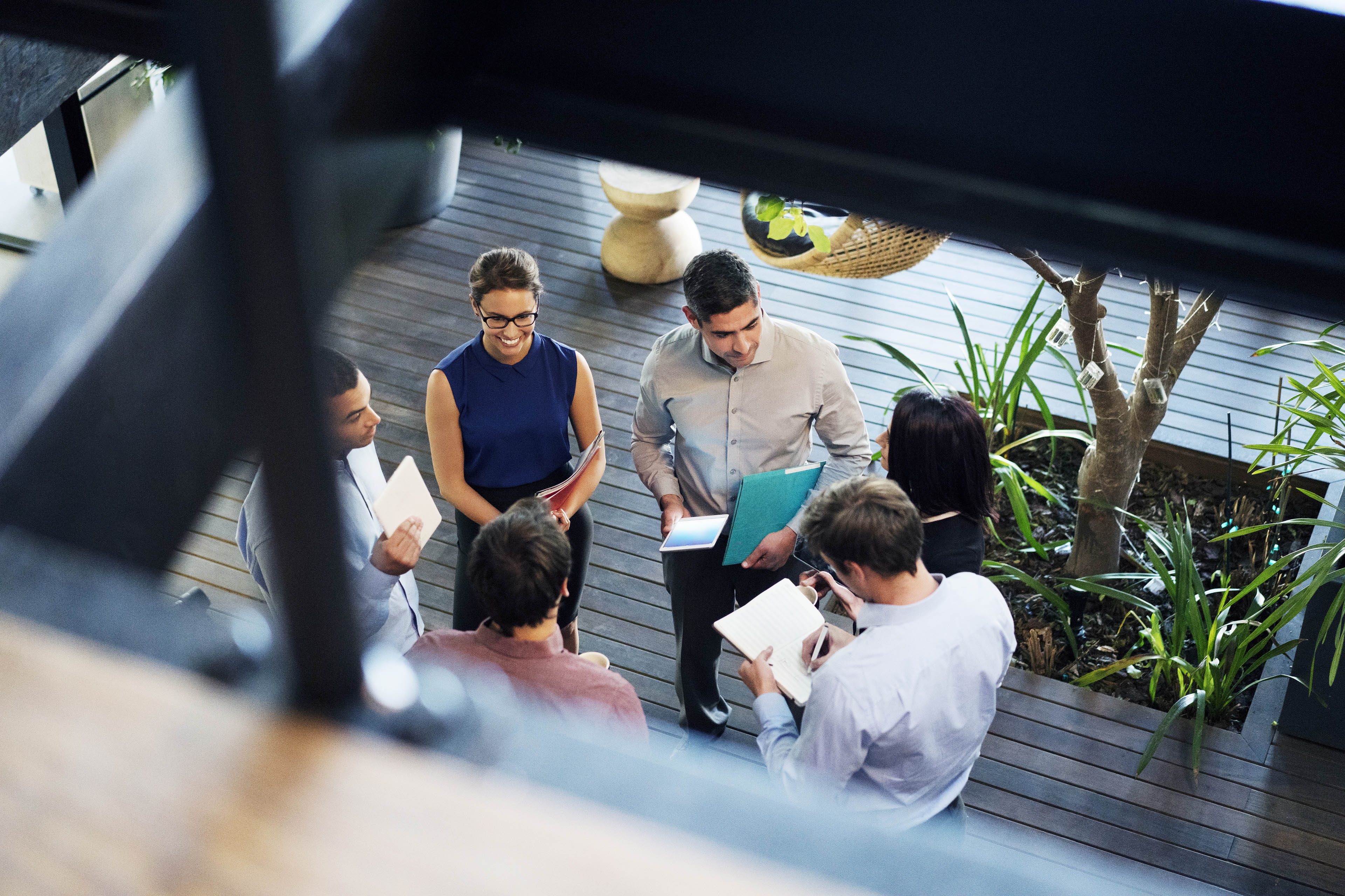 High angle view of business people discussing at lobby