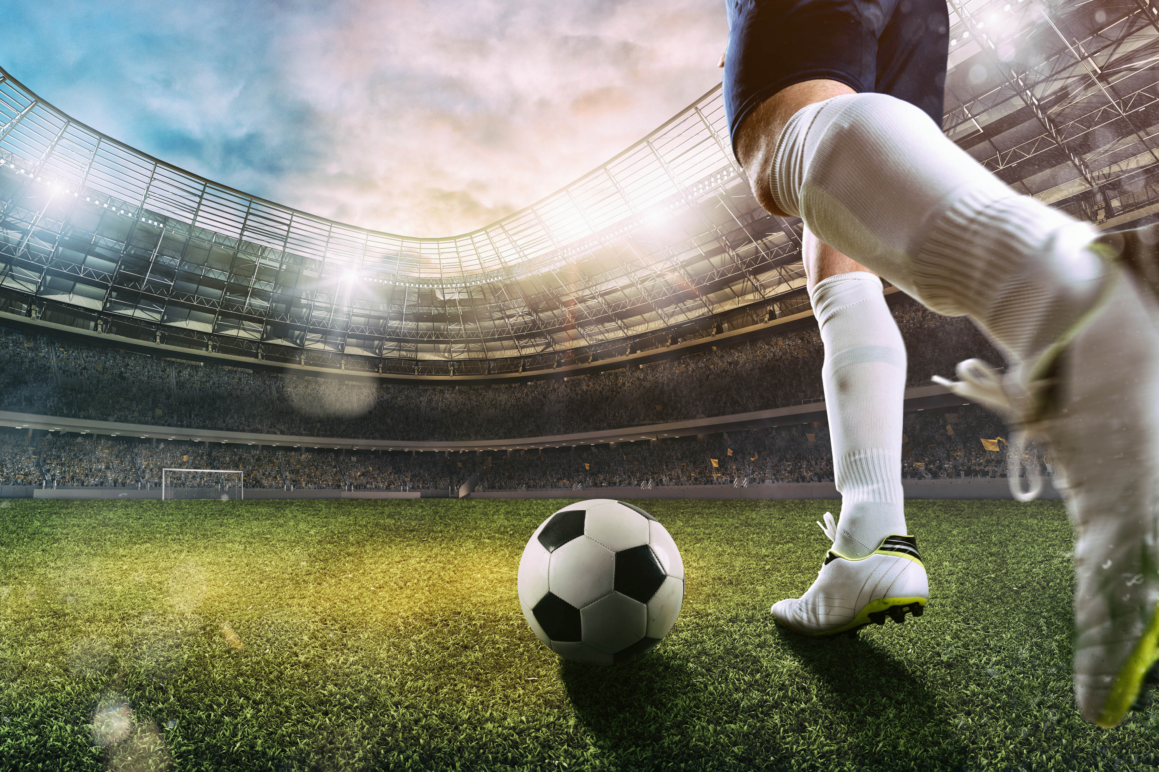 Soccer player at the stadium with the soccerball